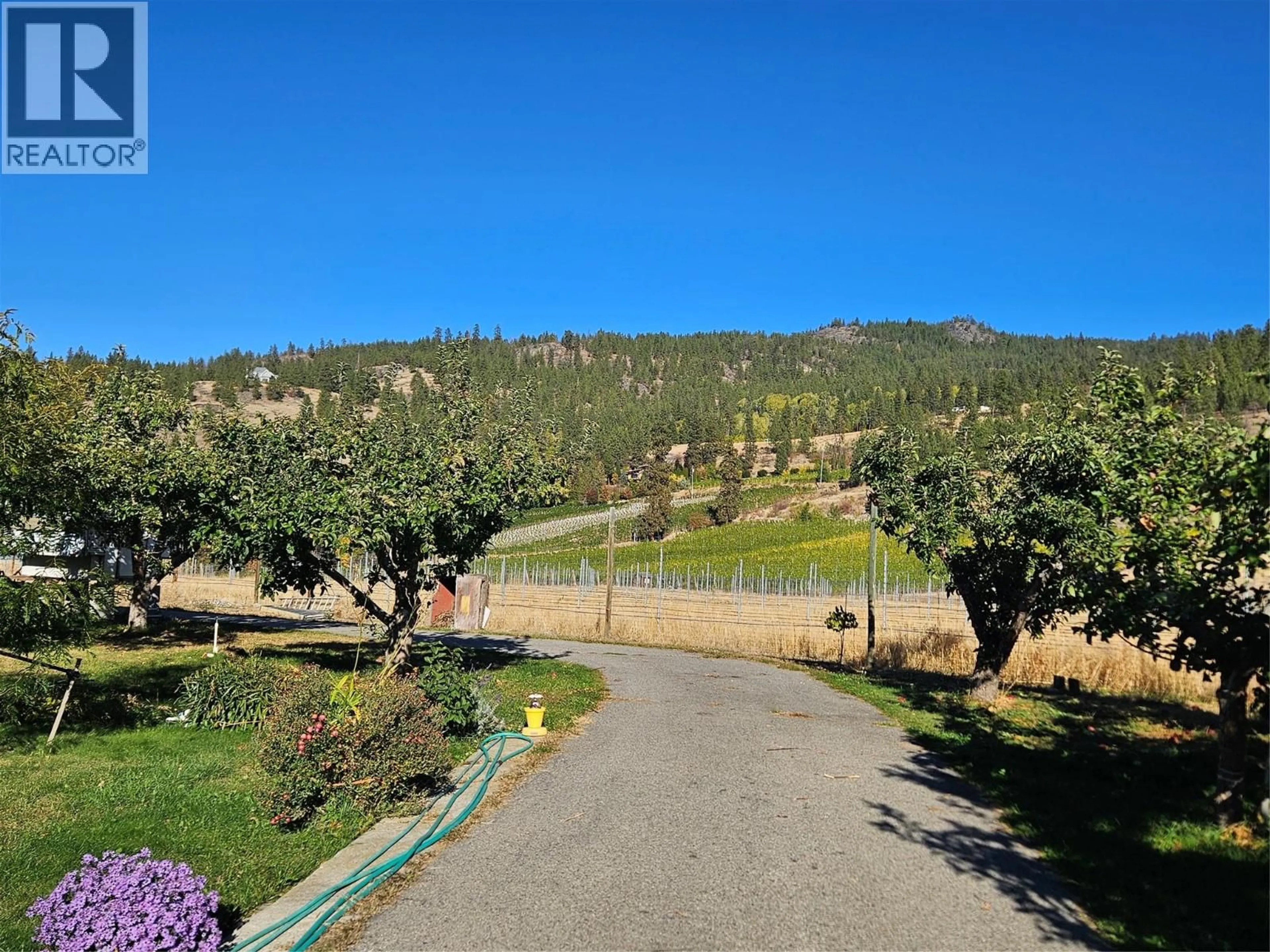 A pic from outside/outdoor area/front of a property/back of a property/a pic from drone, mountain view for 1340 TODD ROAD, Penticton British Columbia V2A8T6