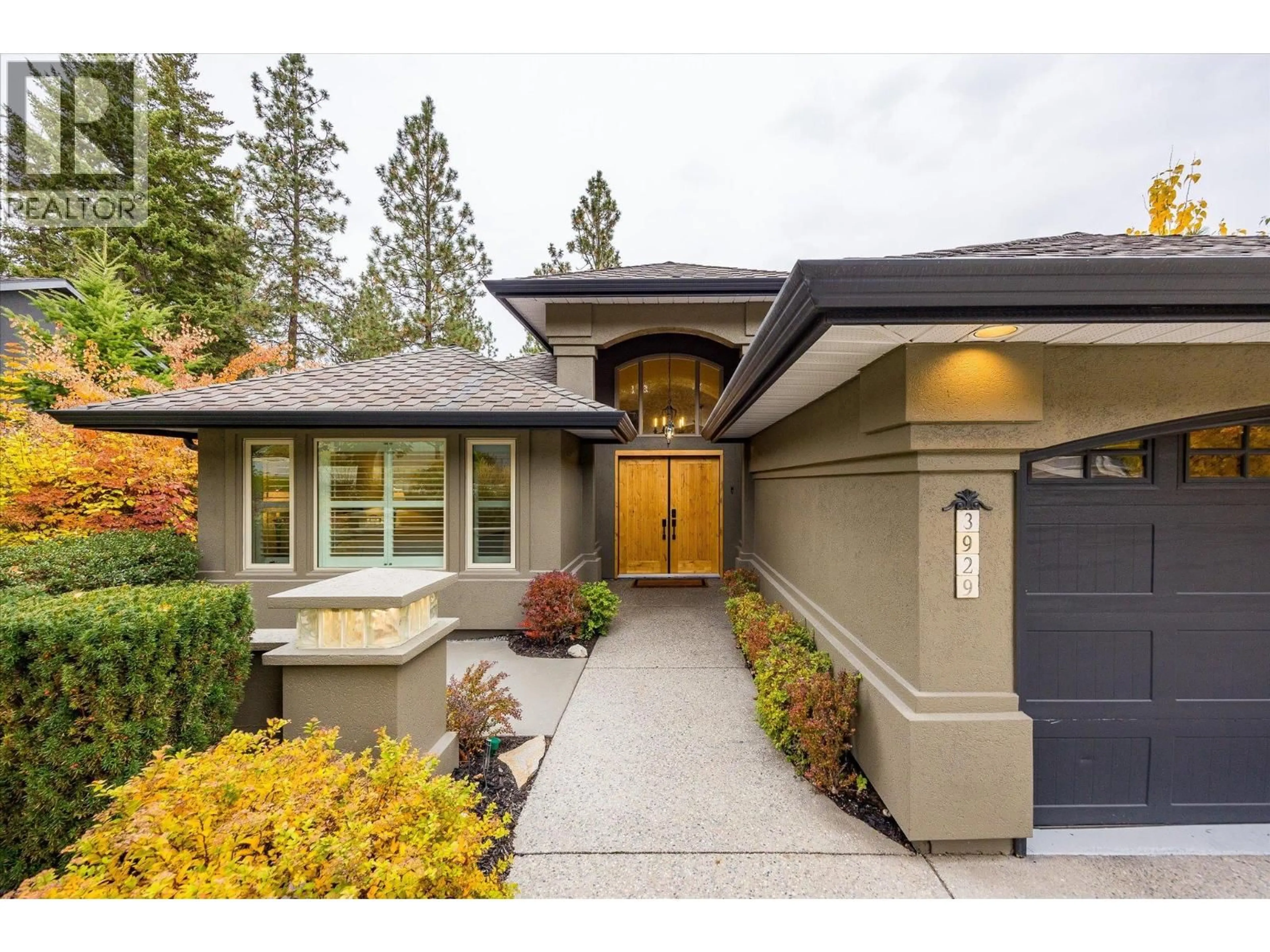Home with vinyl exterior material, street for 3929 GALLAGHERS CIRCLE, Kelowna British Columbia V1W3Z9
