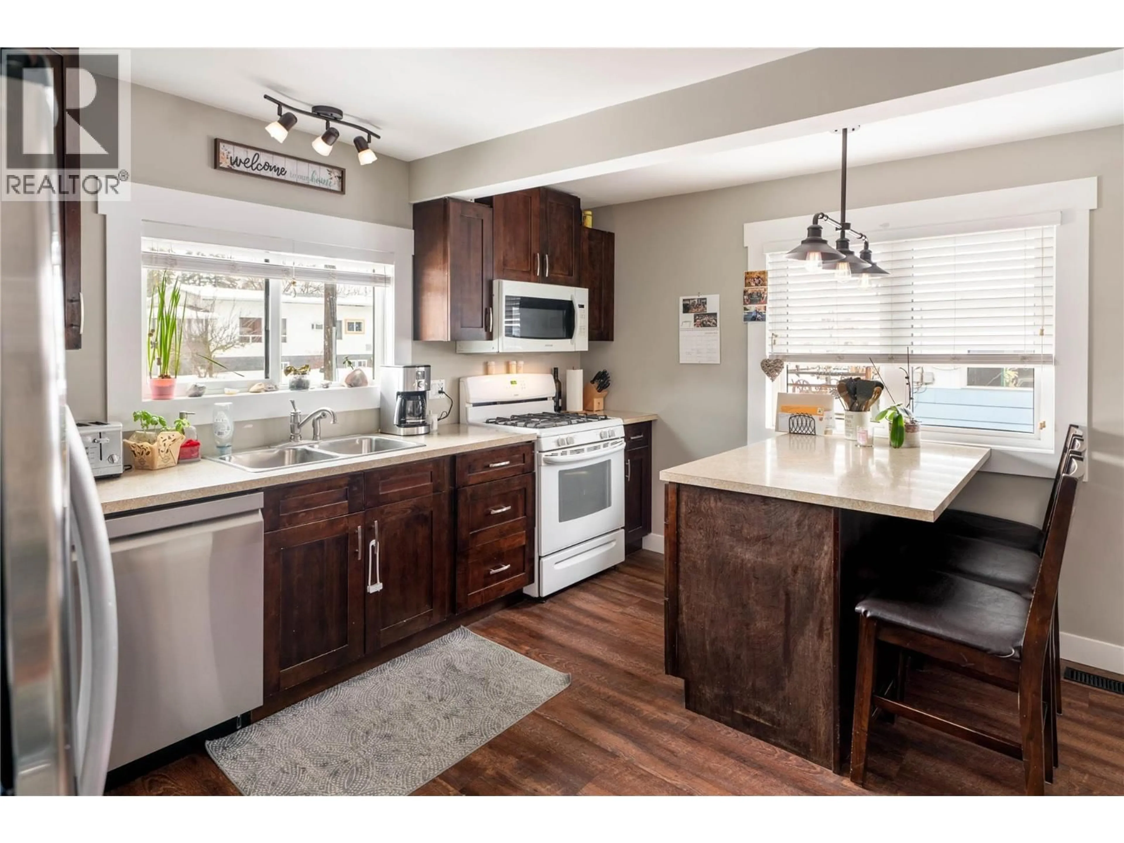 Open concept kitchen, wood/laminate floor for 170 MUGFORD ROAD, Kelowna British Columbia V1X2E2