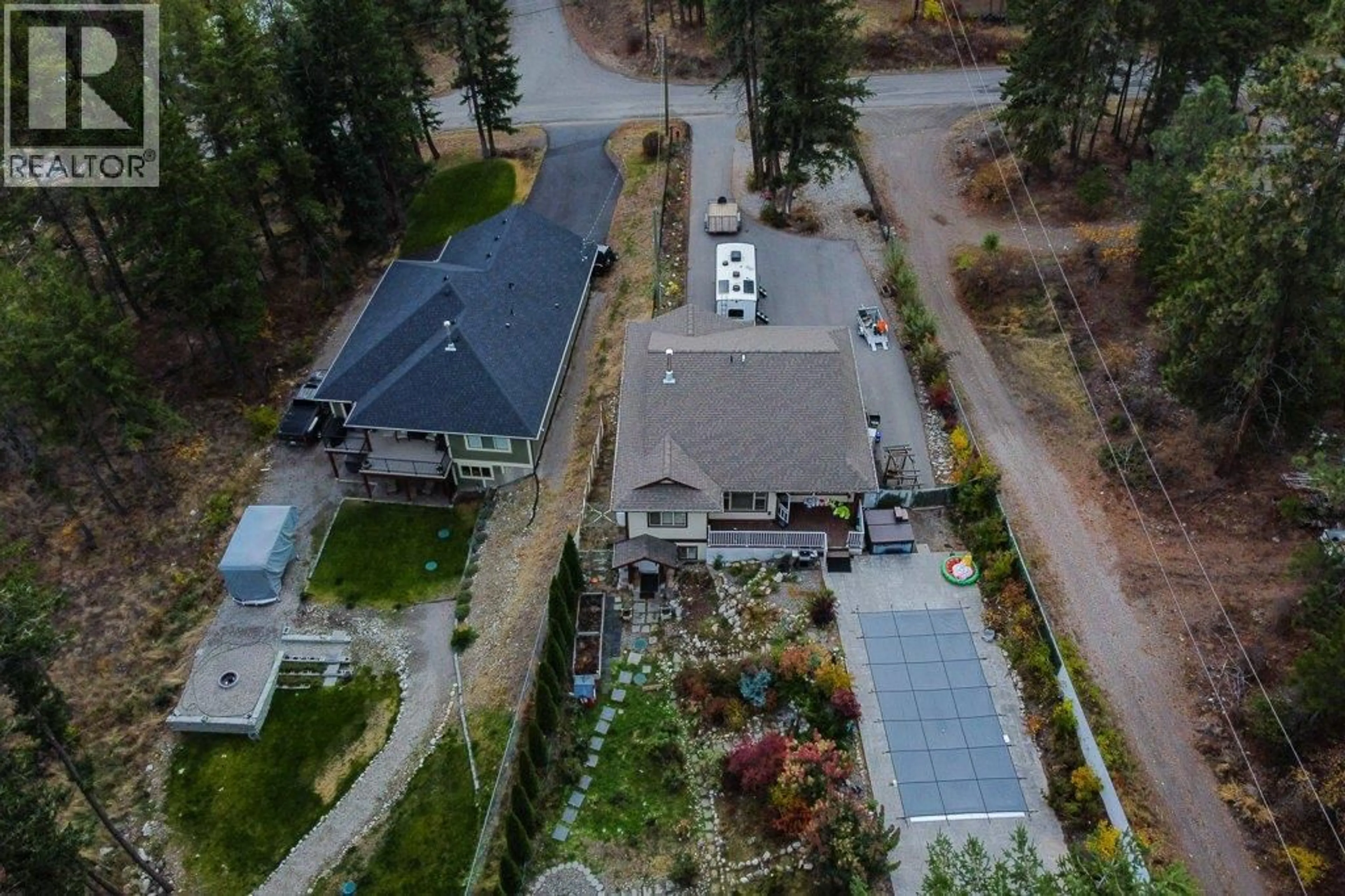 A pic from outside/outdoor area/front of a property/back of a property/a pic from drone, unknown for 750 FIRWOOD ROAD, Kelowna British Columbia V1Z3V5
