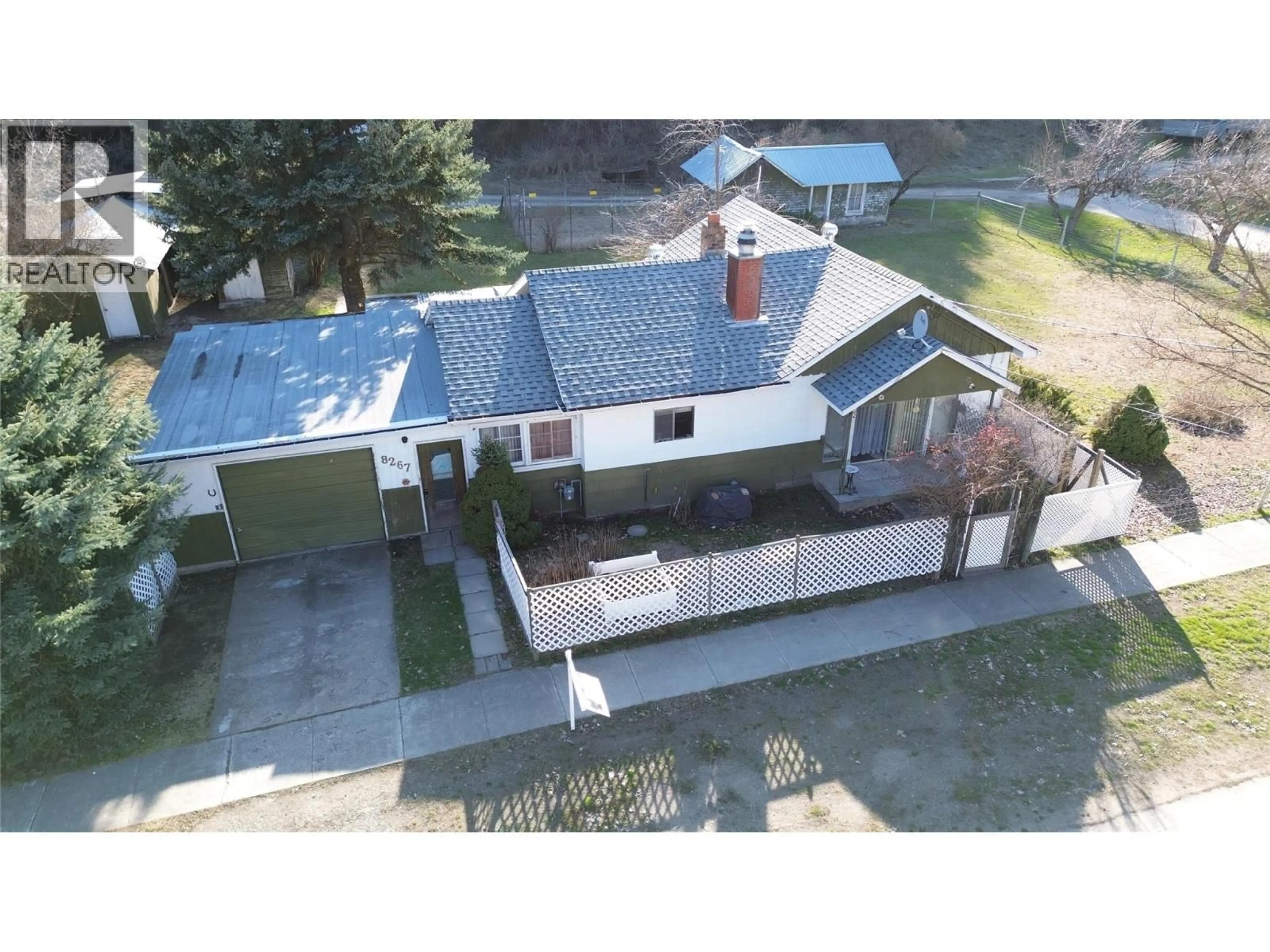 A pic from outside/outdoor area/front of a property/back of a property/a pic from drone, street for 8267 RIVERSIDE DRIVE, Grand Forks British Columbia V0H1H0