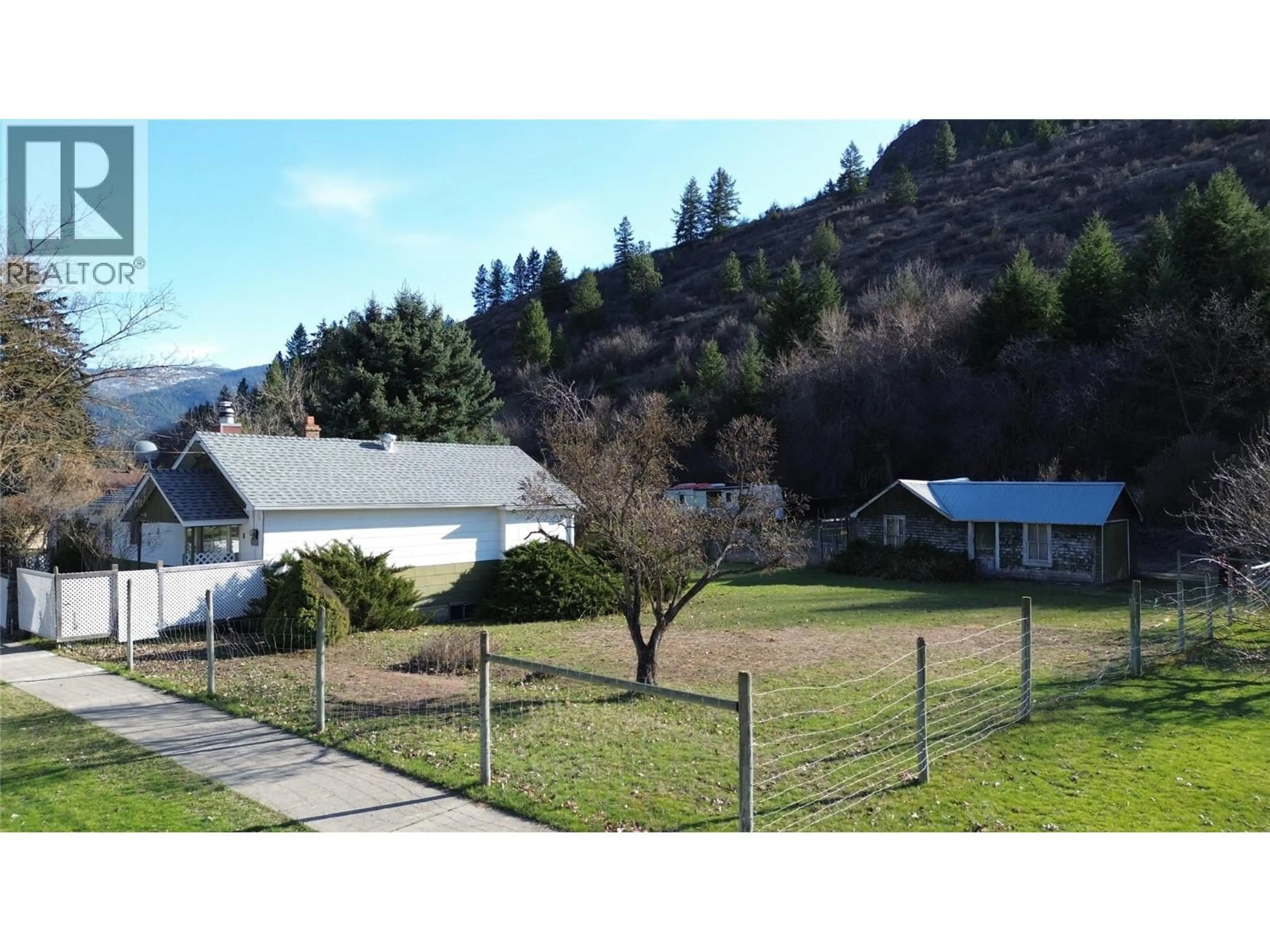 A pic from outside/outdoor area/front of a property/back of a property/a pic from drone, mountain view for 8267 RIVERSIDE DRIVE, Grand Forks British Columbia V0H1H0