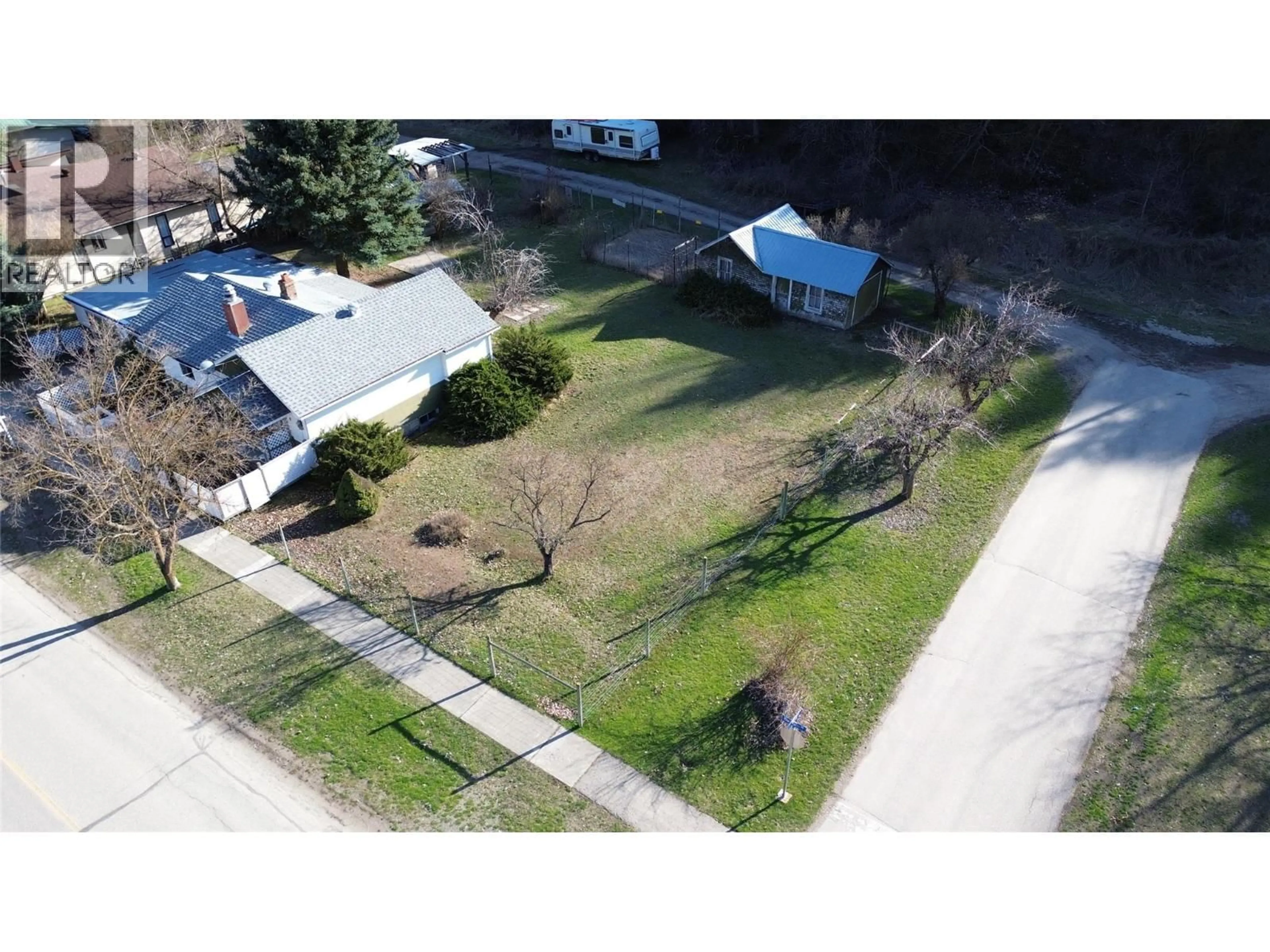 A pic from outside/outdoor area/front of a property/back of a property/a pic from drone, street for 8267 RIVERSIDE DRIVE, Grand Forks British Columbia V0H1H0