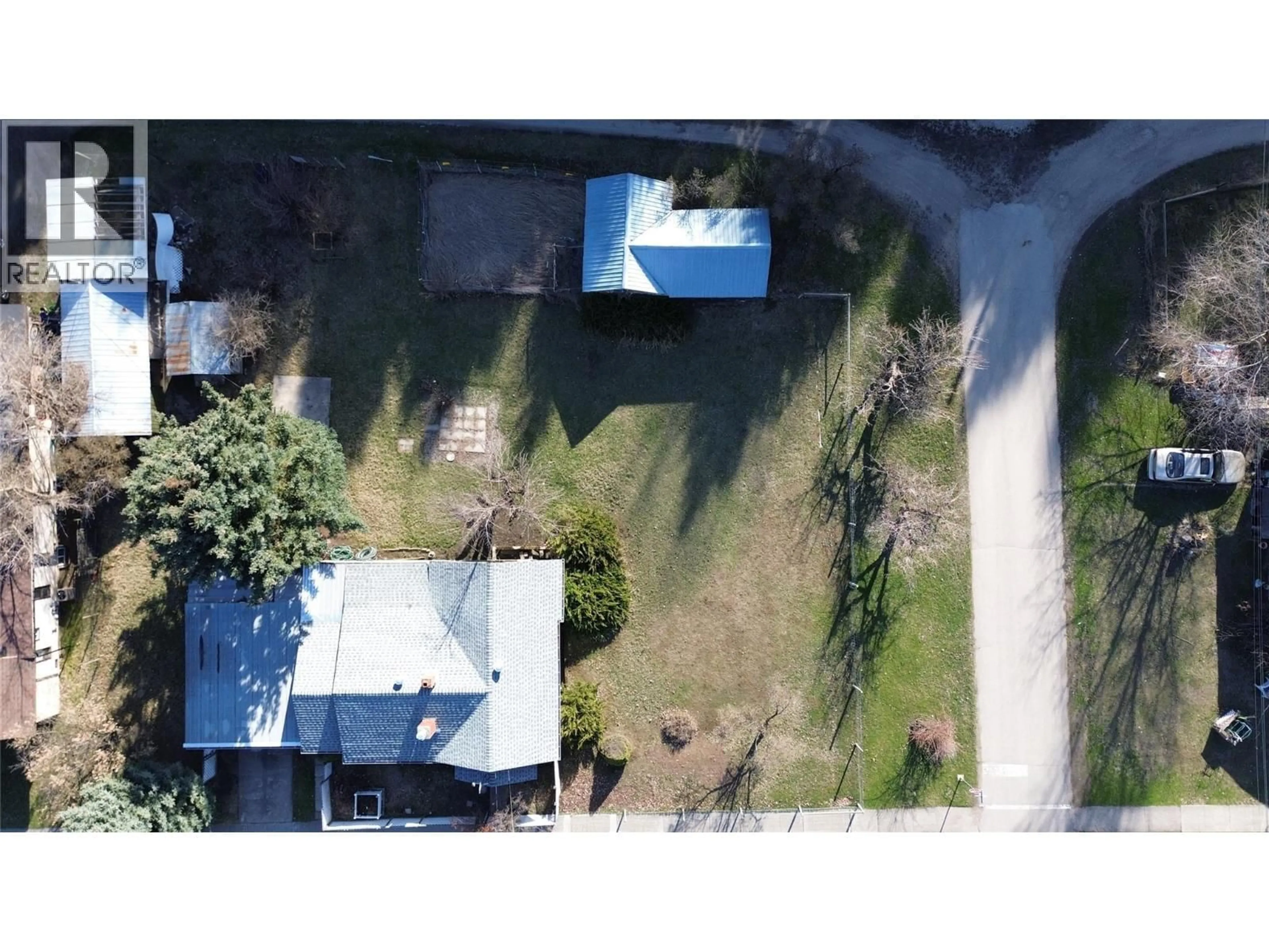 A pic from outside/outdoor area/front of a property/back of a property/a pic from drone, street for 8267 RIVERSIDE DRIVE, Grand Forks British Columbia V0H1H0