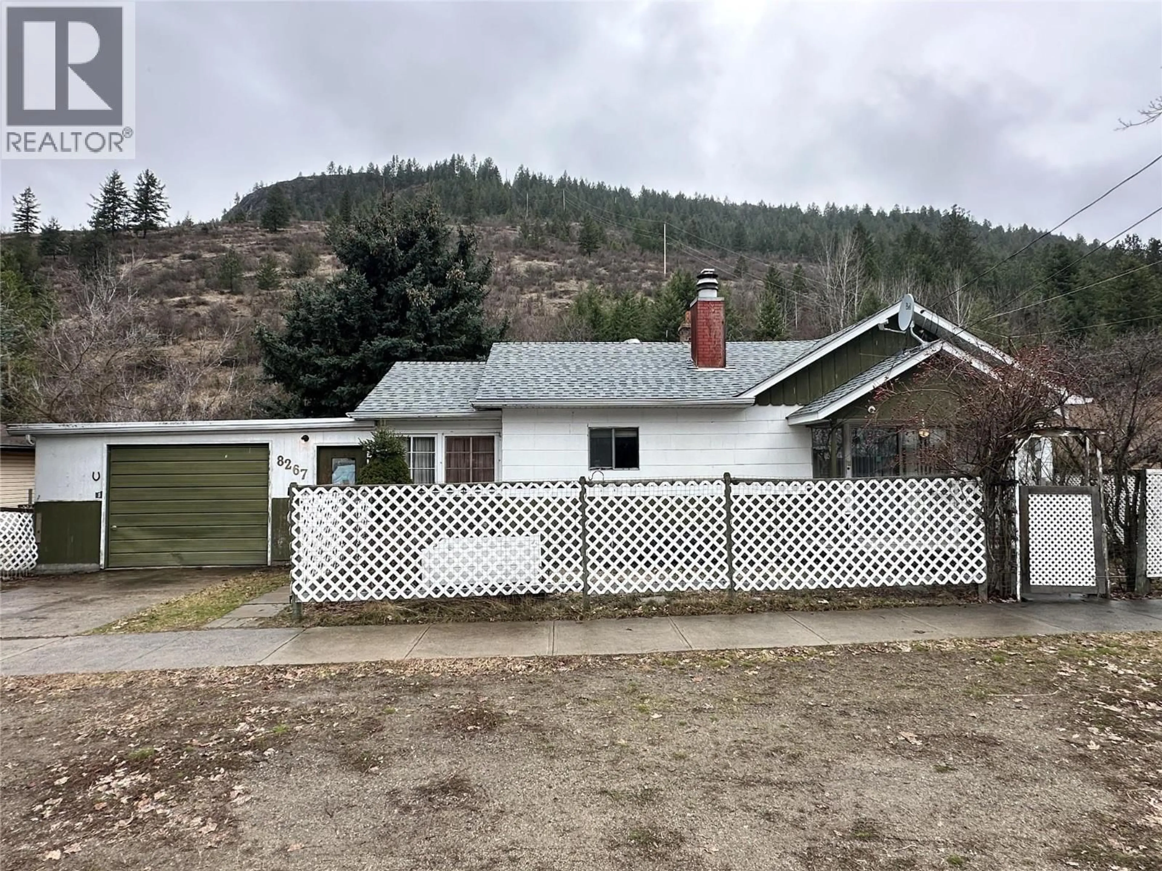 A pic from outside/outdoor area/front of a property/back of a property/a pic from drone, mountain view for 8267 RIVERSIDE DRIVE, Grand Forks British Columbia V0H1H0