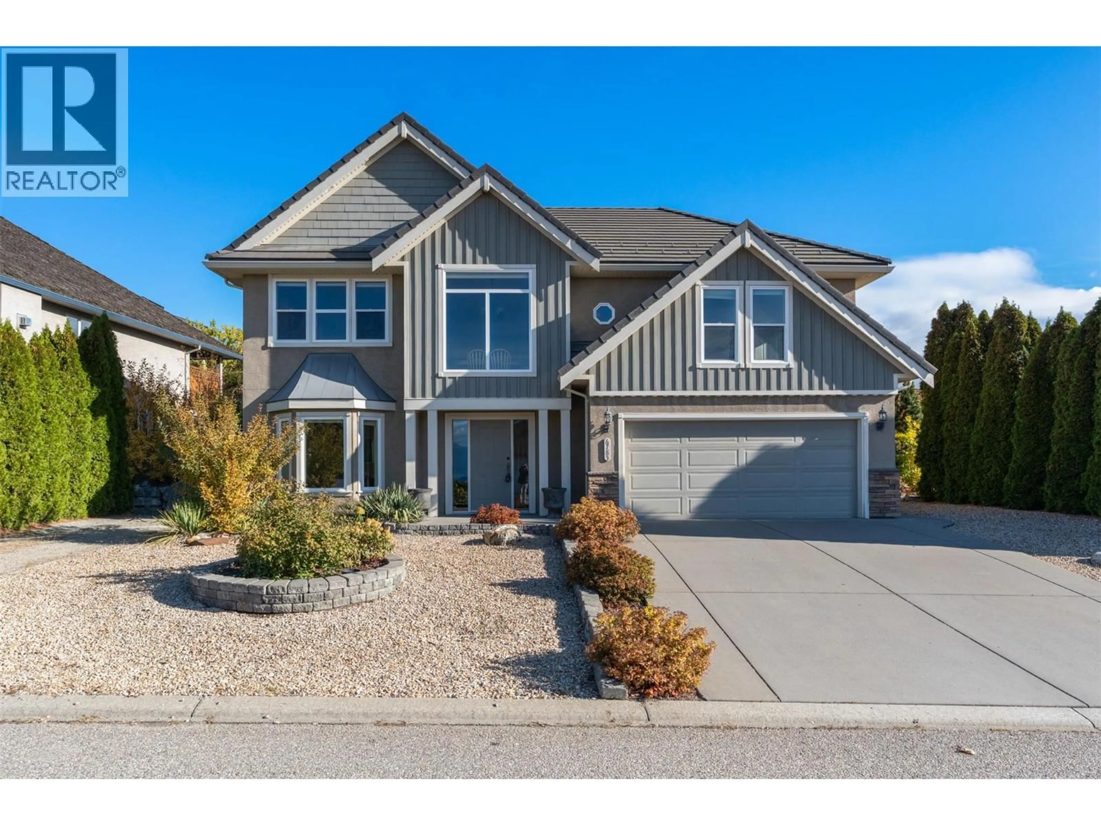 Home with vinyl exterior material, street for 6785 FOOTHILLS DRIVE, Vernon British Columbia V1B3W2