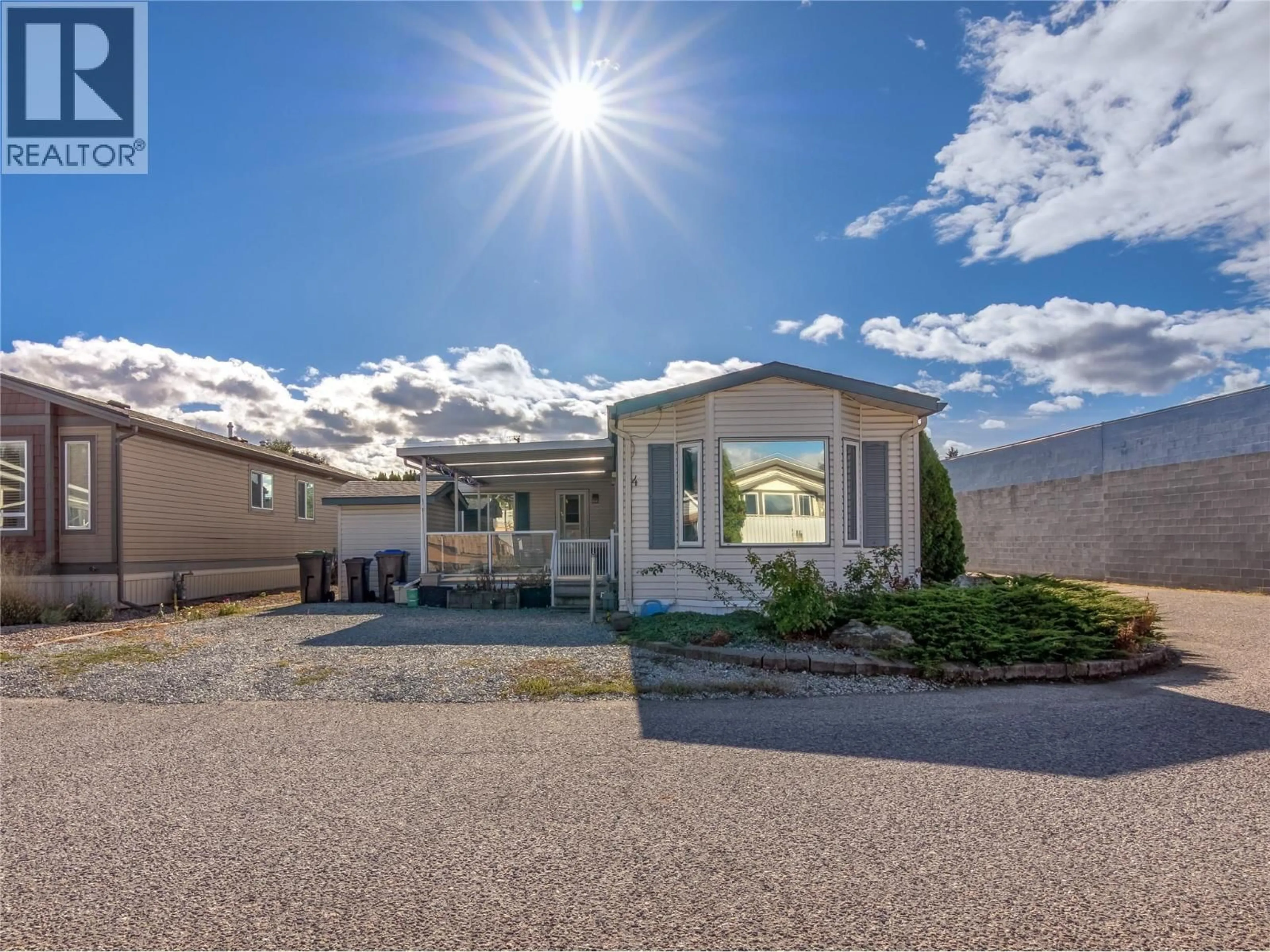 Home with vinyl exterior material, street for 4 - 670 MCCURDY ROAD, Kelowna British Columbia V1X2P5