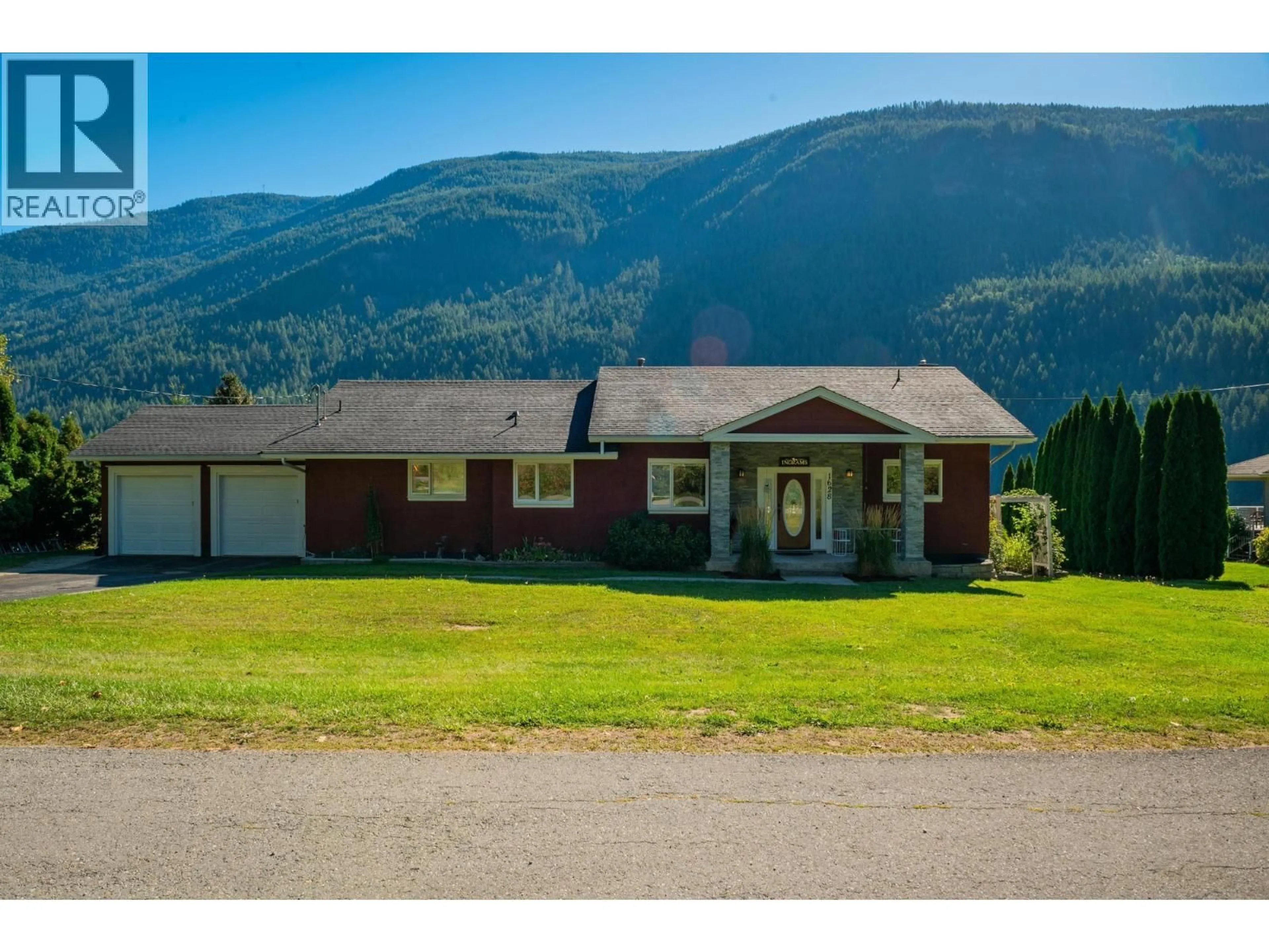 A pic from outside/outdoor area/front of a property/back of a property/a pic from drone, mountain view for 1628 THRUMS ROAD, Castlegar British Columbia V1N4R7