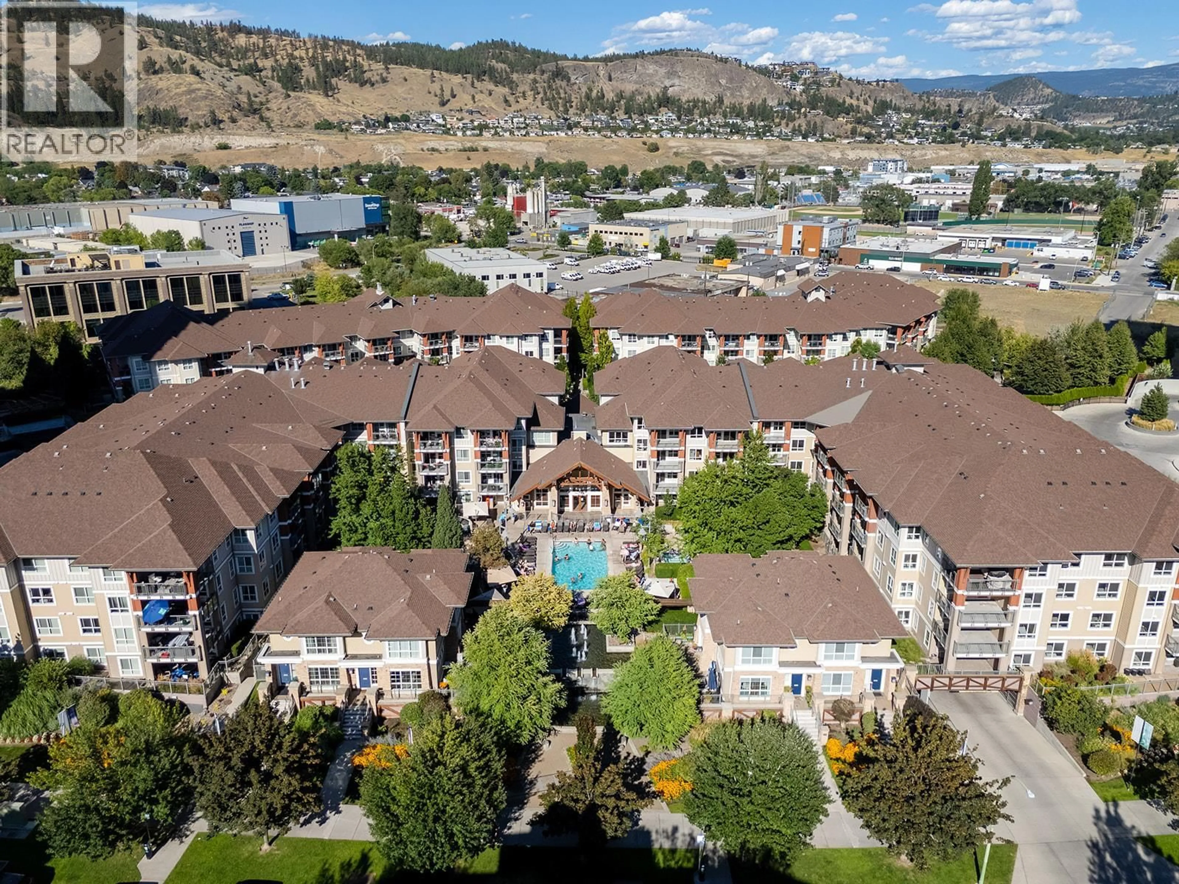 A pic from outside/outdoor area/front of a property/back of a property/a pic from drone, mountain view for 431 - 1099 SUNSET DRIVE, Kelowna British Columbia V1Y9Z2