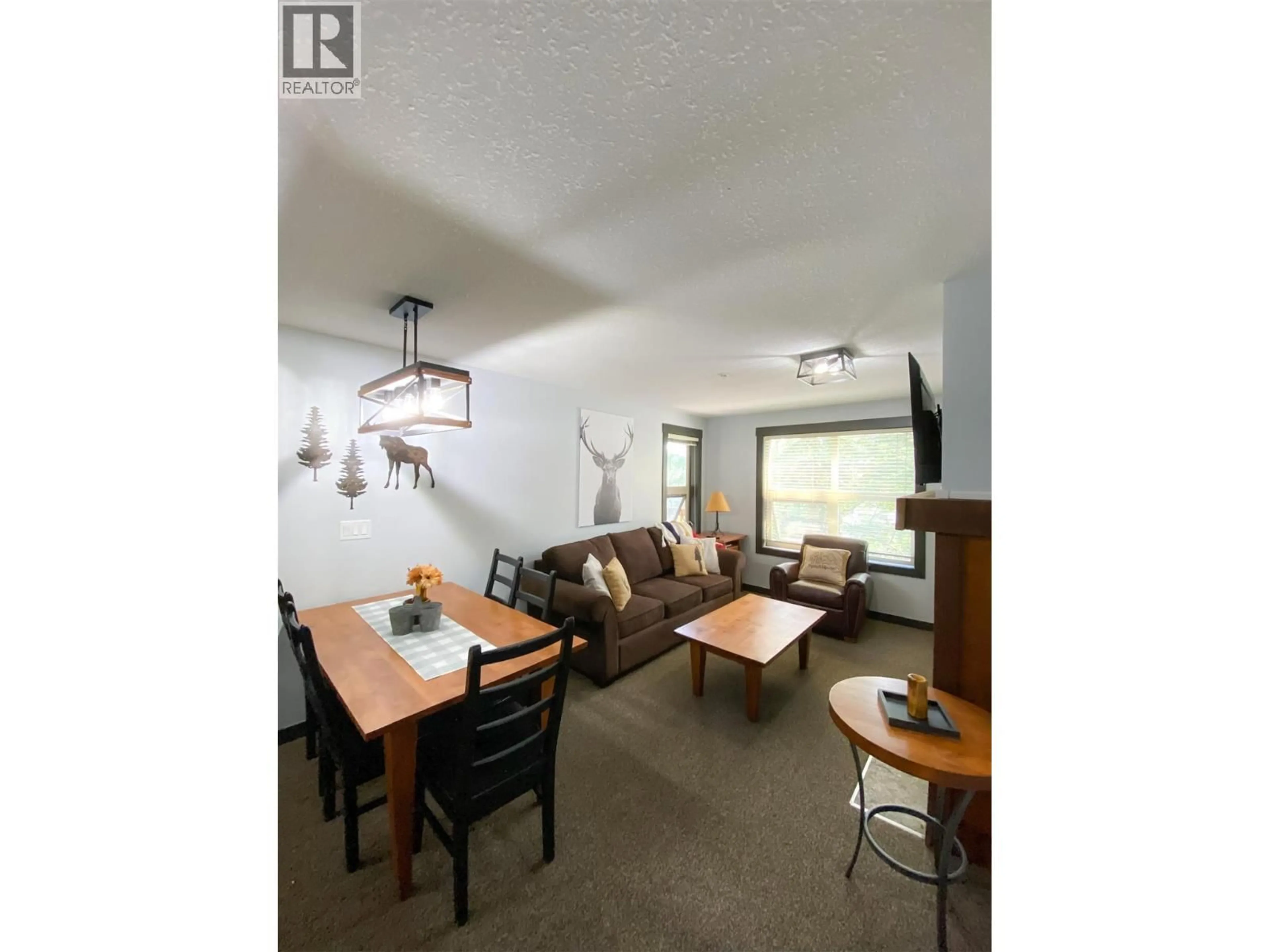 Living room with furniture, wood/laminate floor for 306 - 2070 SUMMIT DRIVE DRIVE, Panorama British Columbia V0A1T0