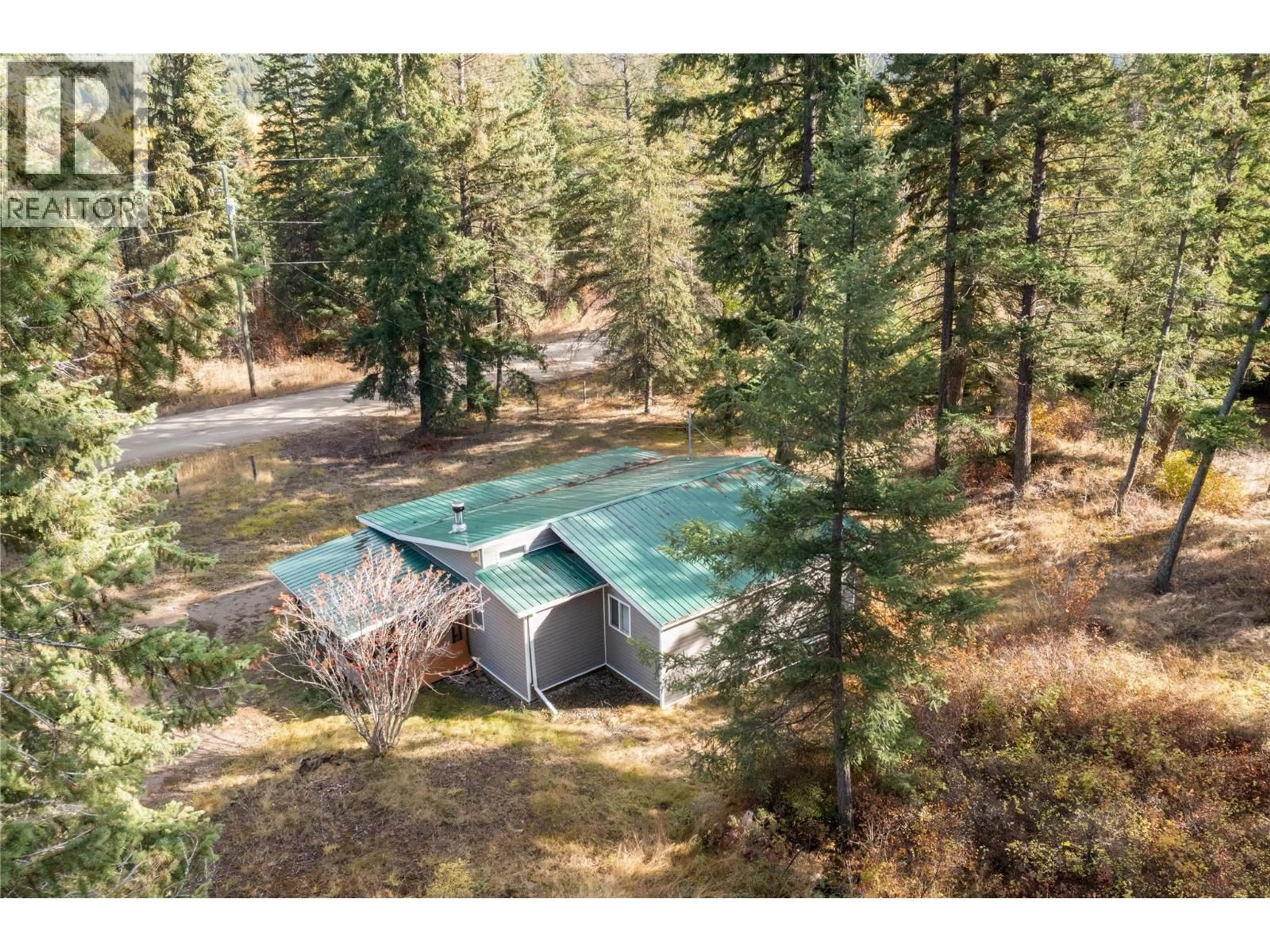 A pic from outside/outdoor area/front of a property/back of a property/a pic from drone, forest/trees view for 8336 SKIMIKIN ROAD, Chase British Columbia V0E1M1
