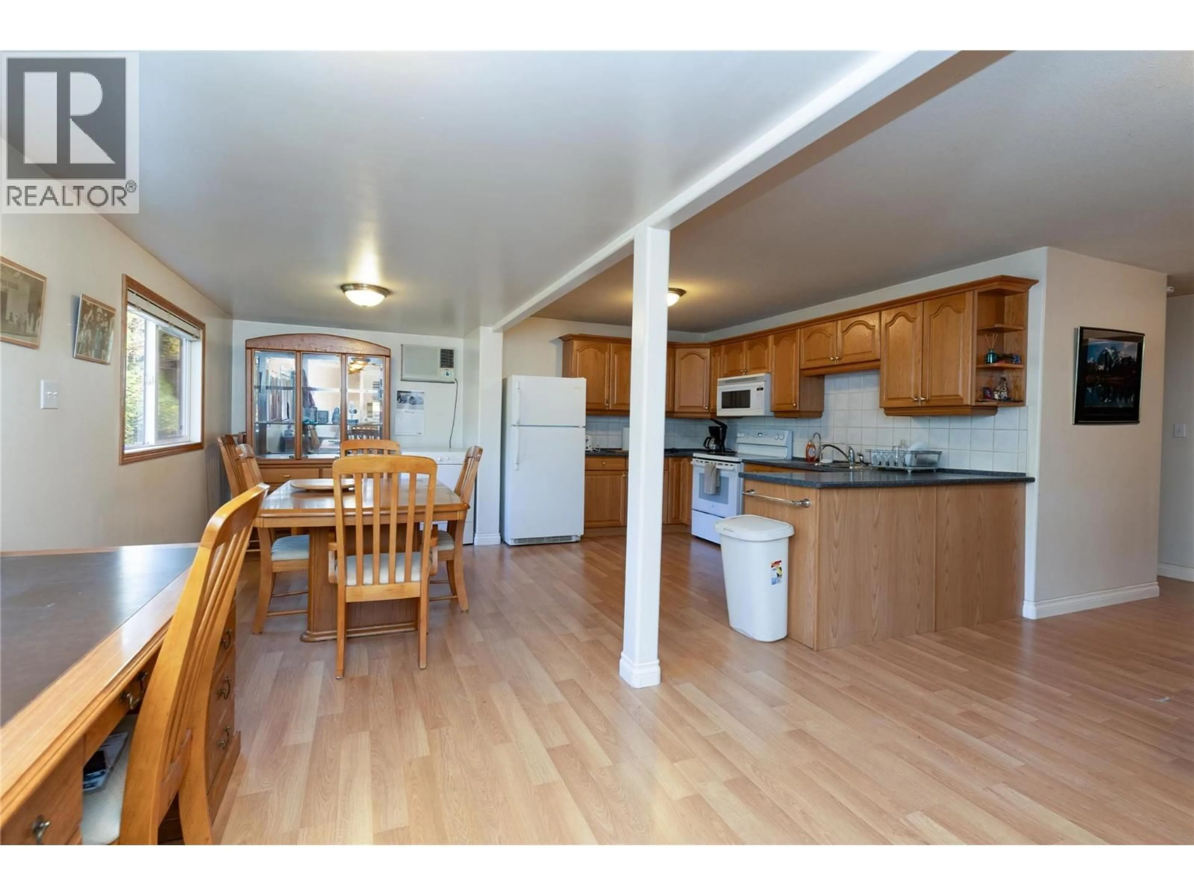 Open concept kitchen, wood/laminate floor for 8336 SKIMIKIN ROAD, Chase British Columbia V0E1M1