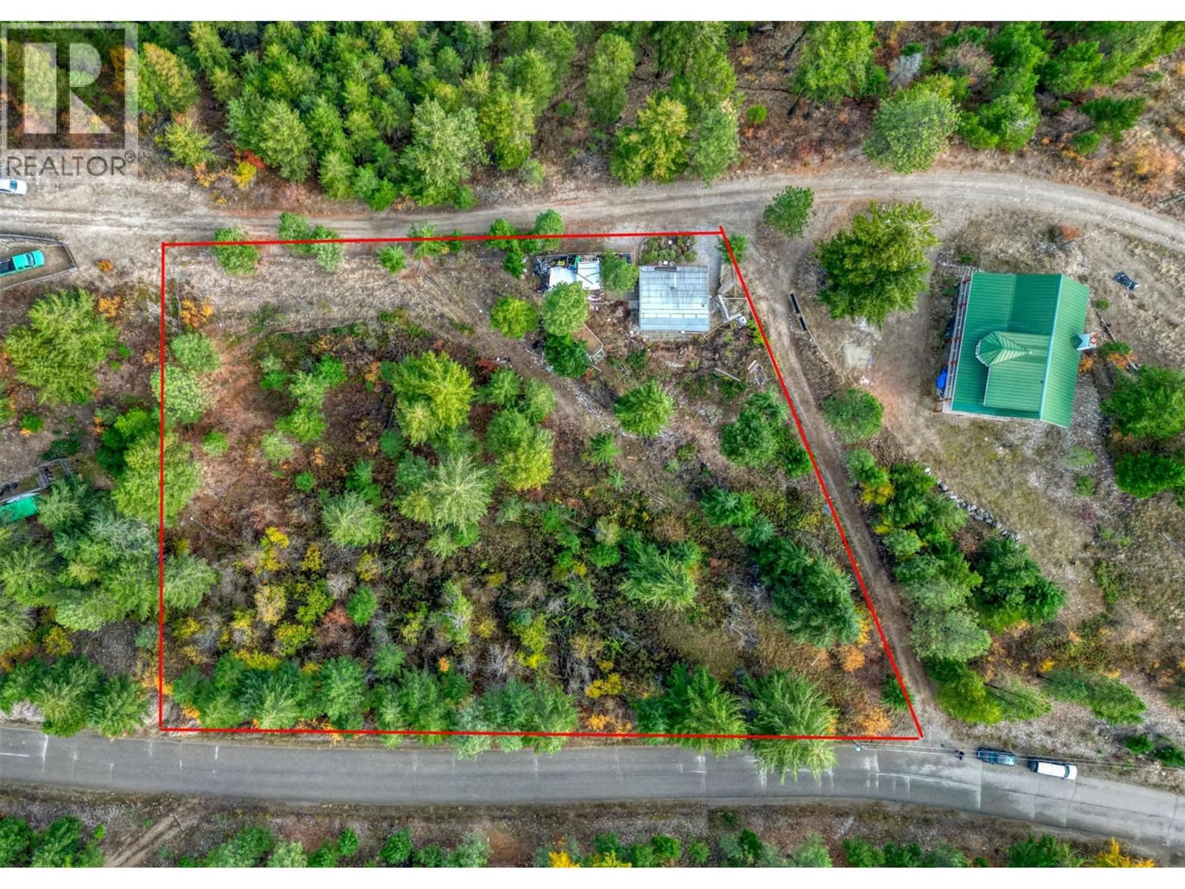 A pic from outside/outdoor area/front of a property/back of a property/a pic from drone, forest/trees view for 348 LAKEWOOD ROAD, Vernon British Columbia v1H2B9