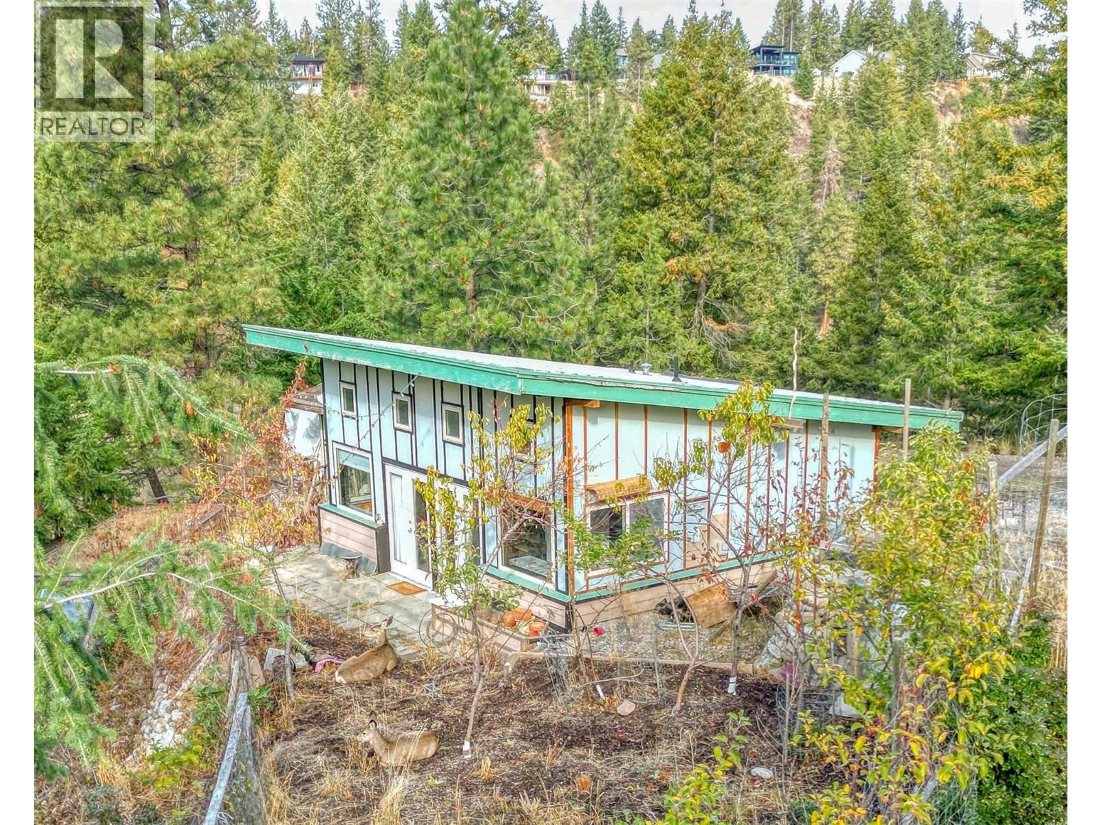 A pic from outside/outdoor area/front of a property/back of a property/a pic from drone, forest/trees view for 348 LAKEWOOD ROAD, Vernon British Columbia v1H2B9