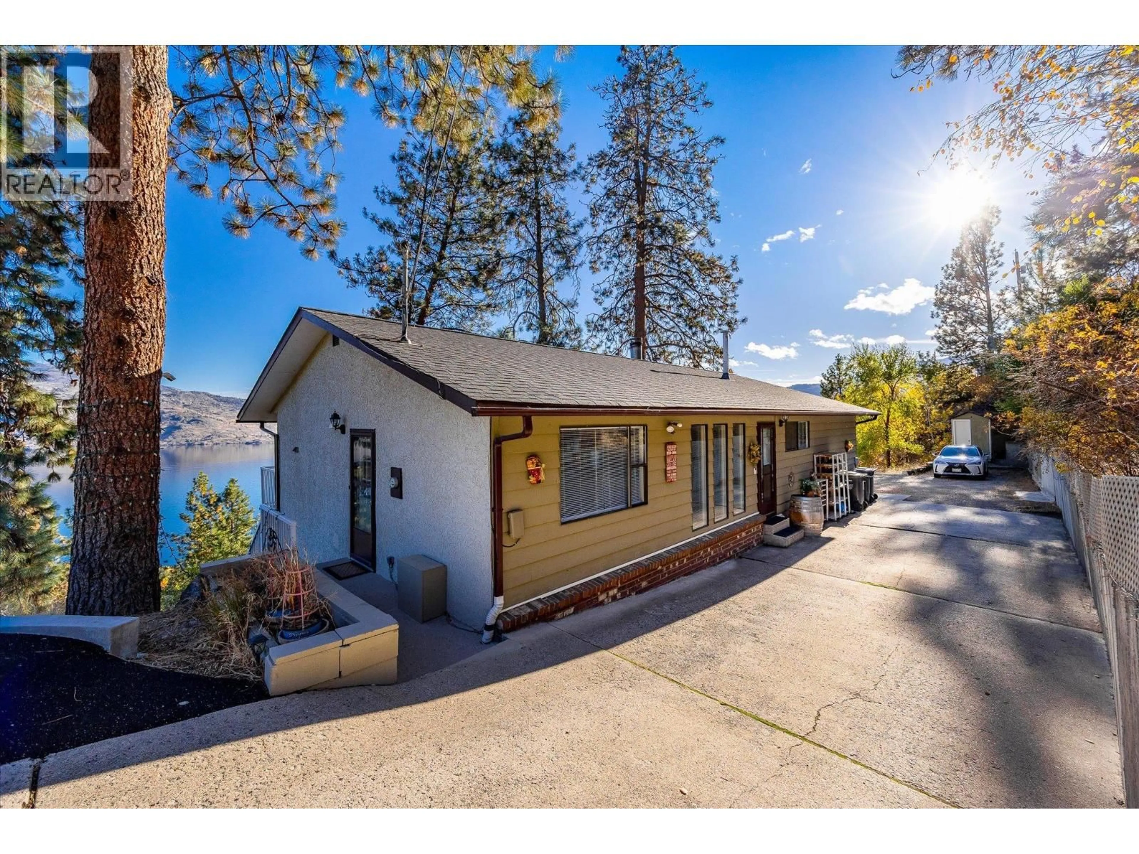 A pic from outside/outdoor area/front of a property/back of a property/a pic from drone, water/lake/river/ocean view for 5821 ATKINSON CRESCENT, Peachland British Columbia V0H1X4