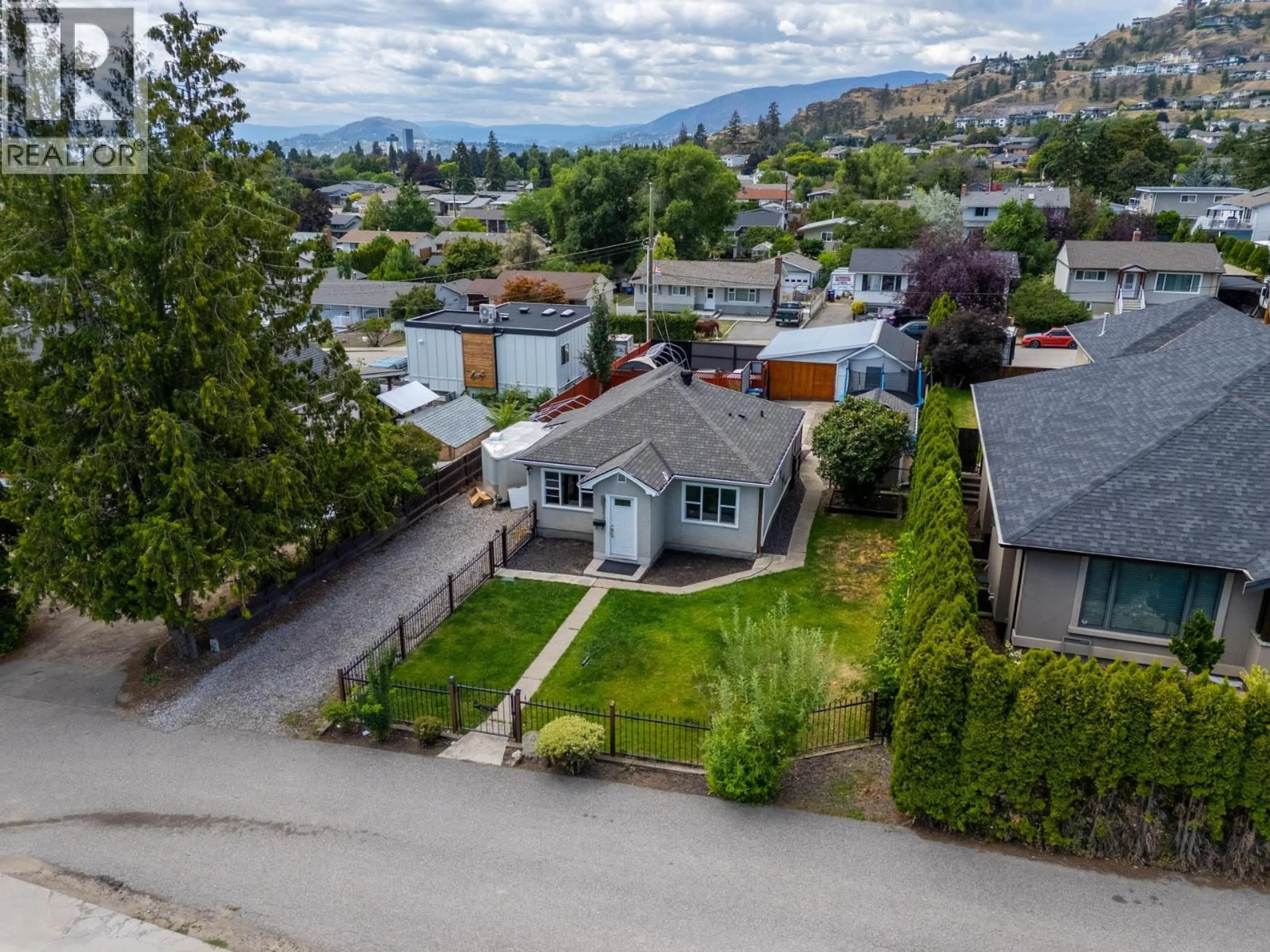 A pic from outside/outdoor area/front of a property/back of a property/a pic from drone, mountain view for 842 GLENMORE DRIVE, Kelowna British Columbia V1Y4N9