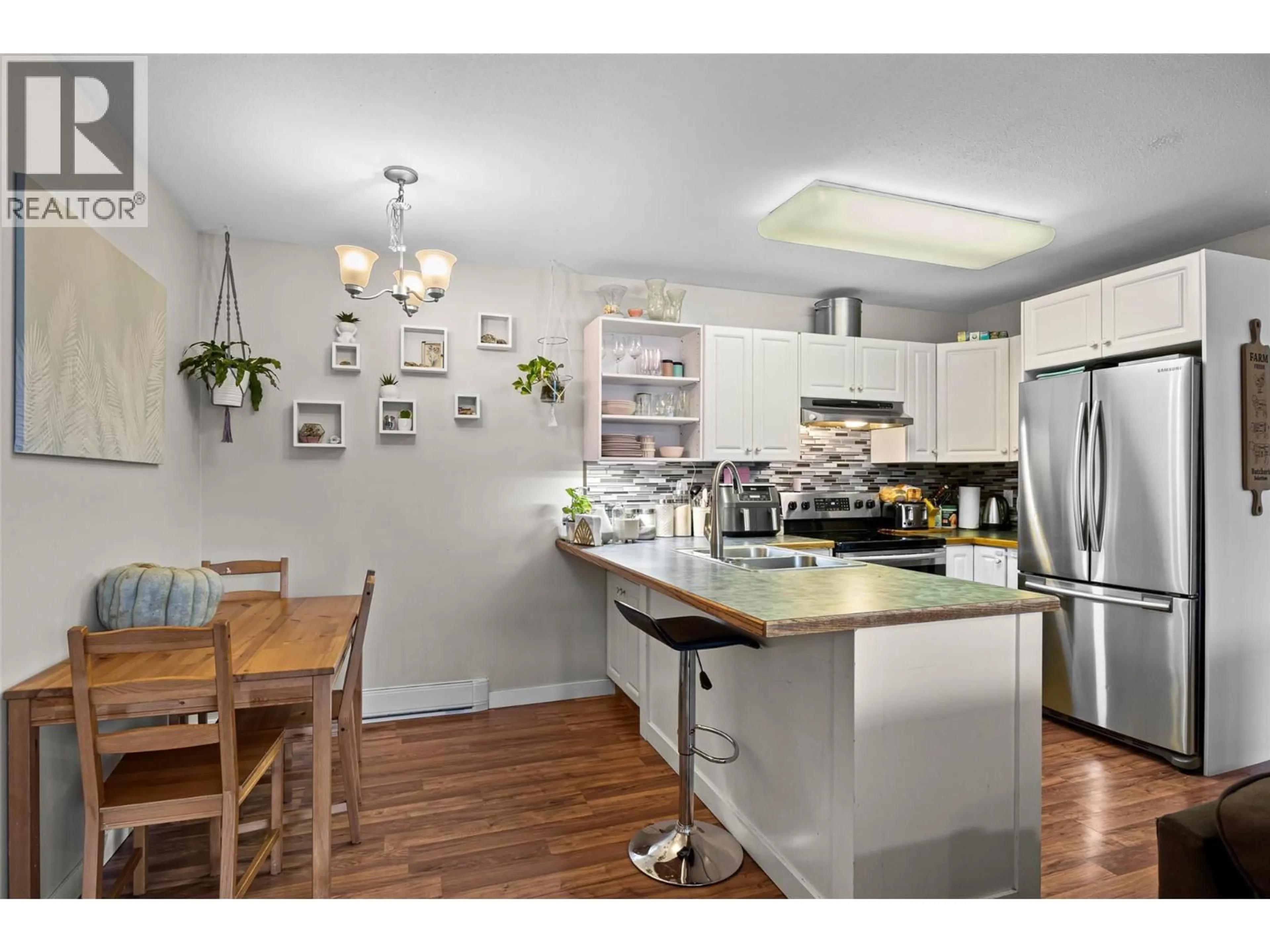 Open concept kitchen, wood/laminate floor for 203 - 380 SHEPHERD ROAD, Chase British Columbia V0E1M0