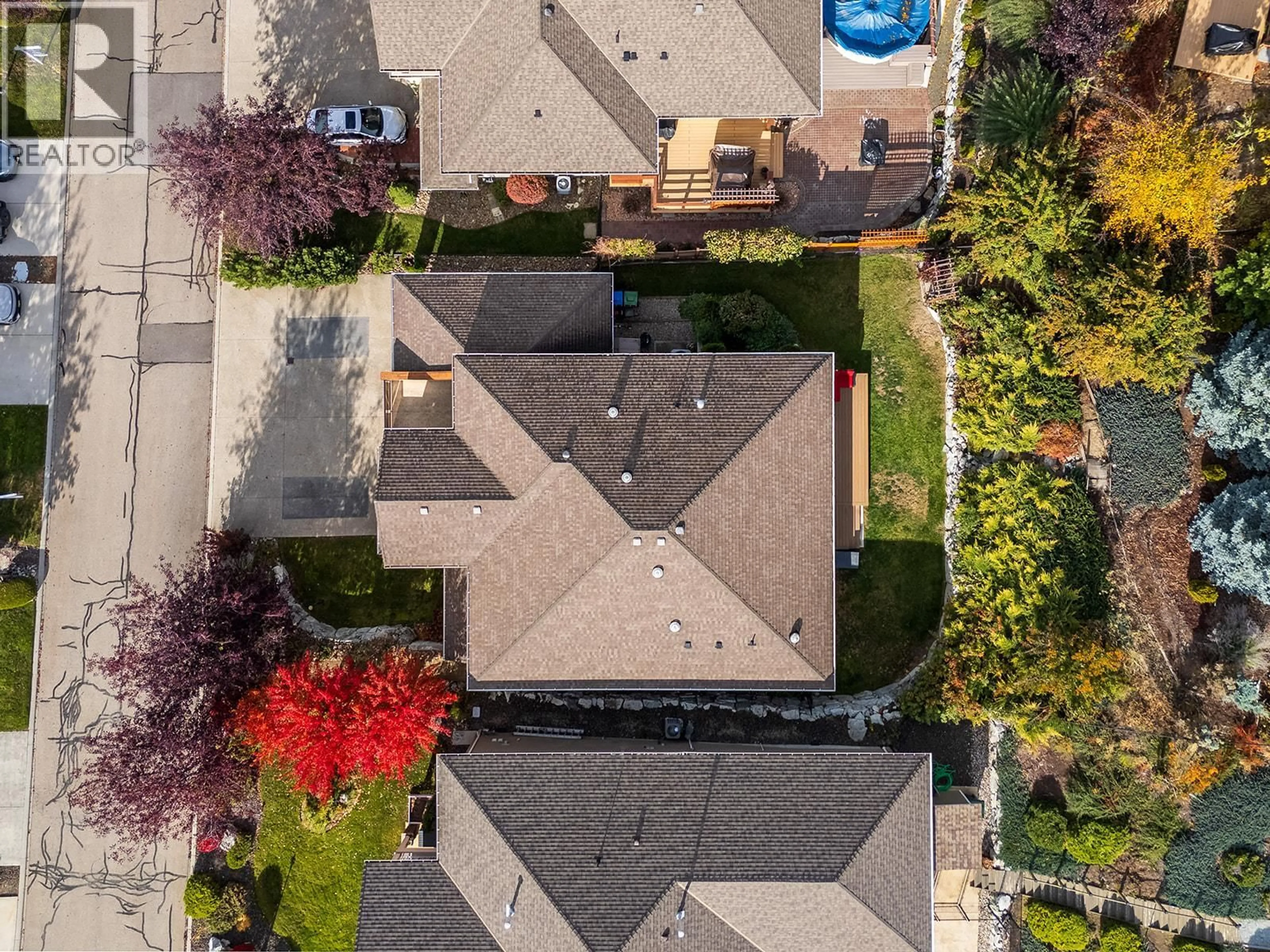 A pic from outside/outdoor area/front of a property/back of a property/a pic from drone, street for 3431 CAMELBACK DRIVE, Kelowna British Columbia V1Z8A8