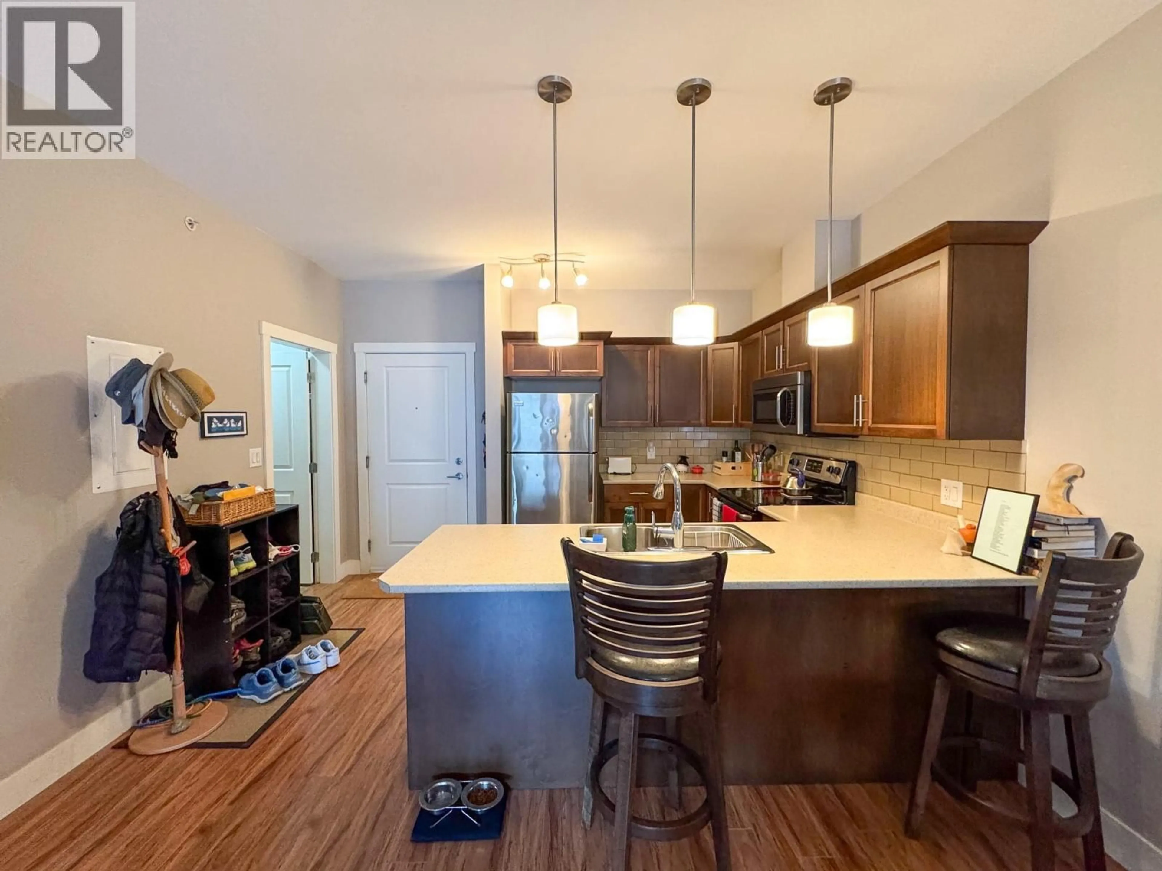 Open concept kitchen, wood/laminate floor for 305 - 1701 MENZIES STREET, Merritt British Columbia V1K1A5