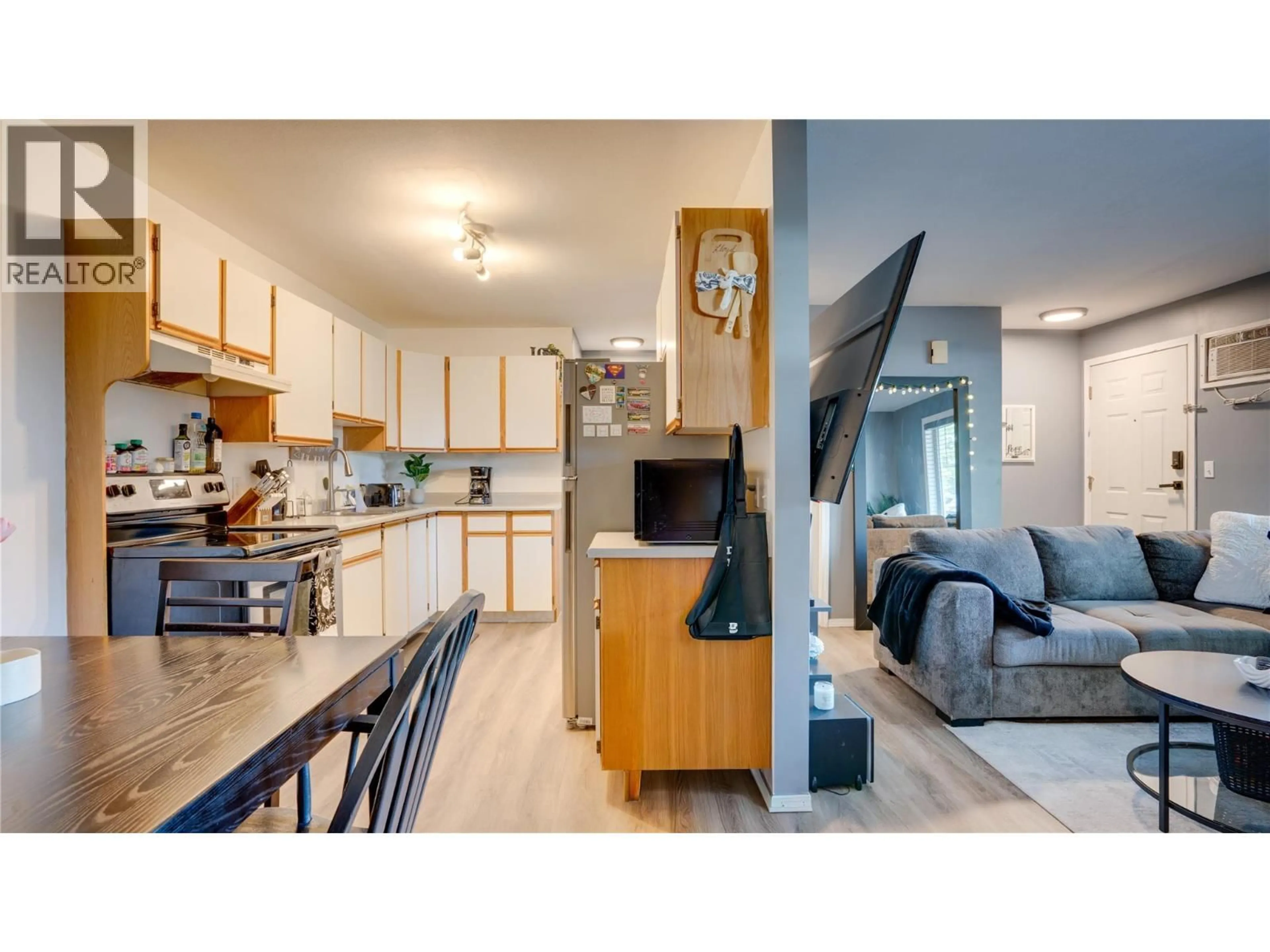 Open concept kitchen, wood/laminate floor for 105 - 1041 MIDDLETON WAY, Vernon British Columbia V1B2N3