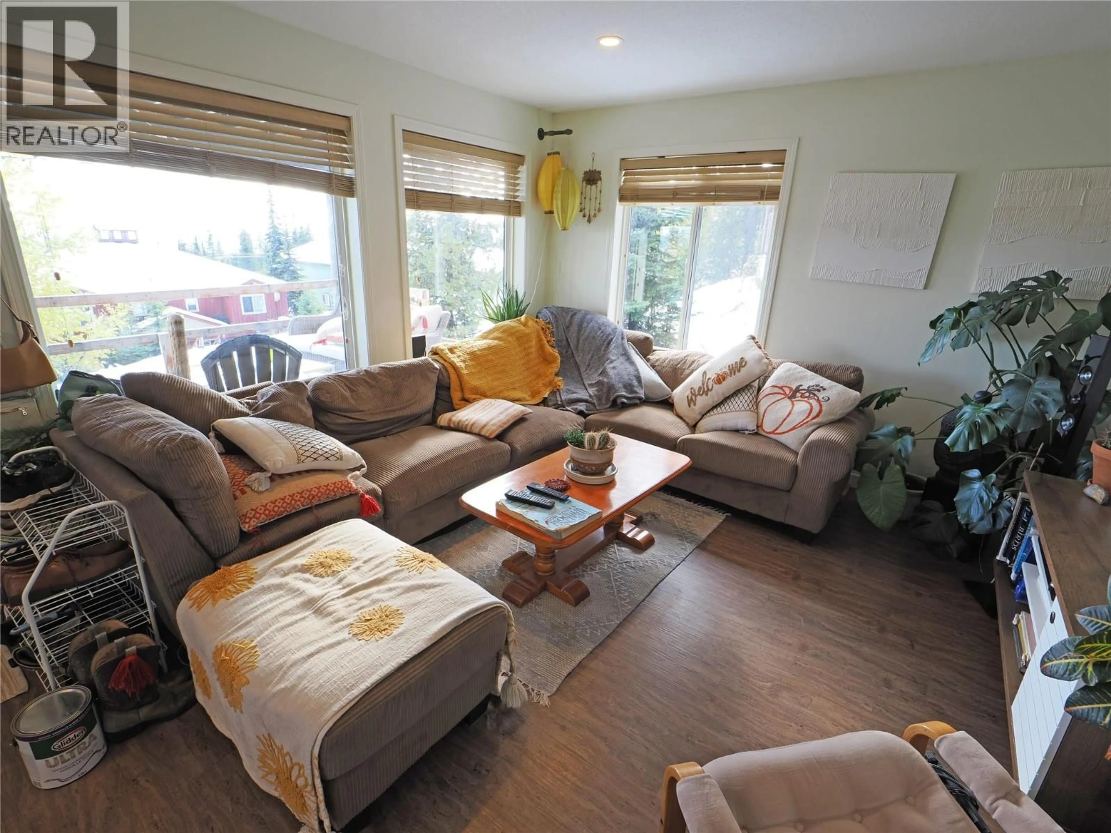 Living room with furniture, wood/laminate floor for 4854 SNOWPINES ROAD, Big White British Columbia V1P1T4