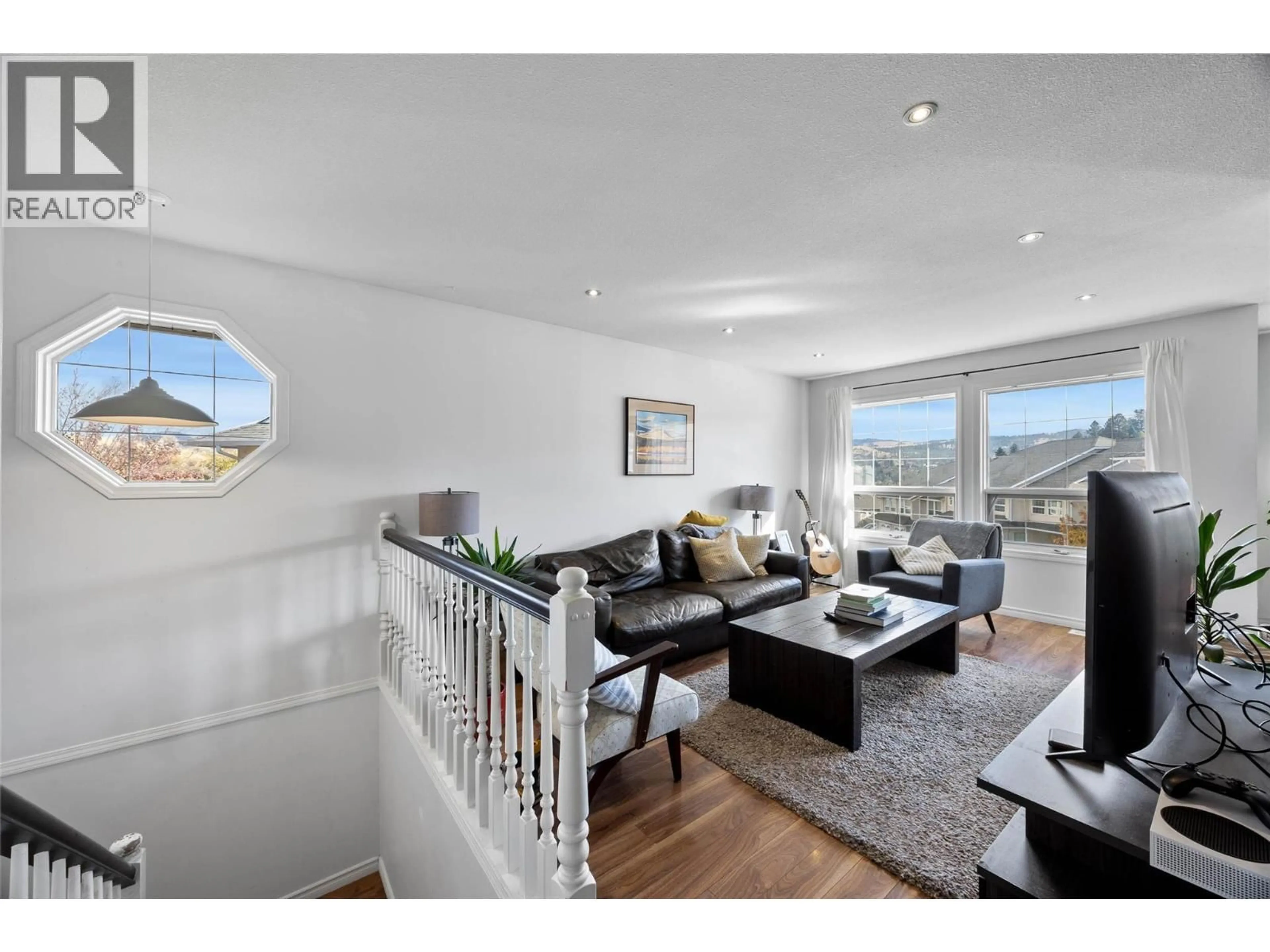 Living room with furniture, wood/laminate floor for 61 - 1775 MCKINLEY COURT, Kamloops British Columbia V2E2P2