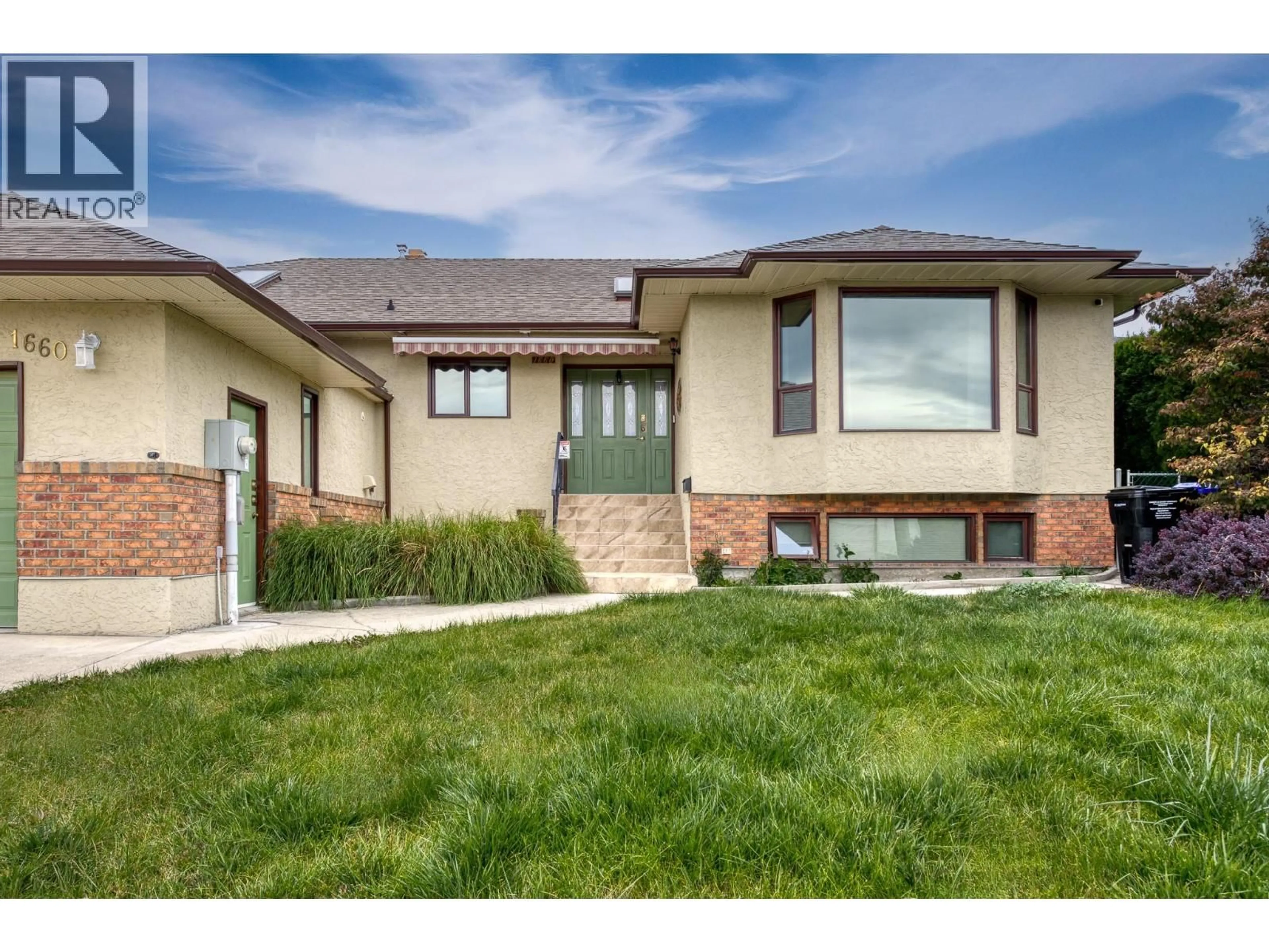 Home with brick exterior material, street for 1660 SONORA DRIVE, Kelowna British Columbia V1Y8Z1