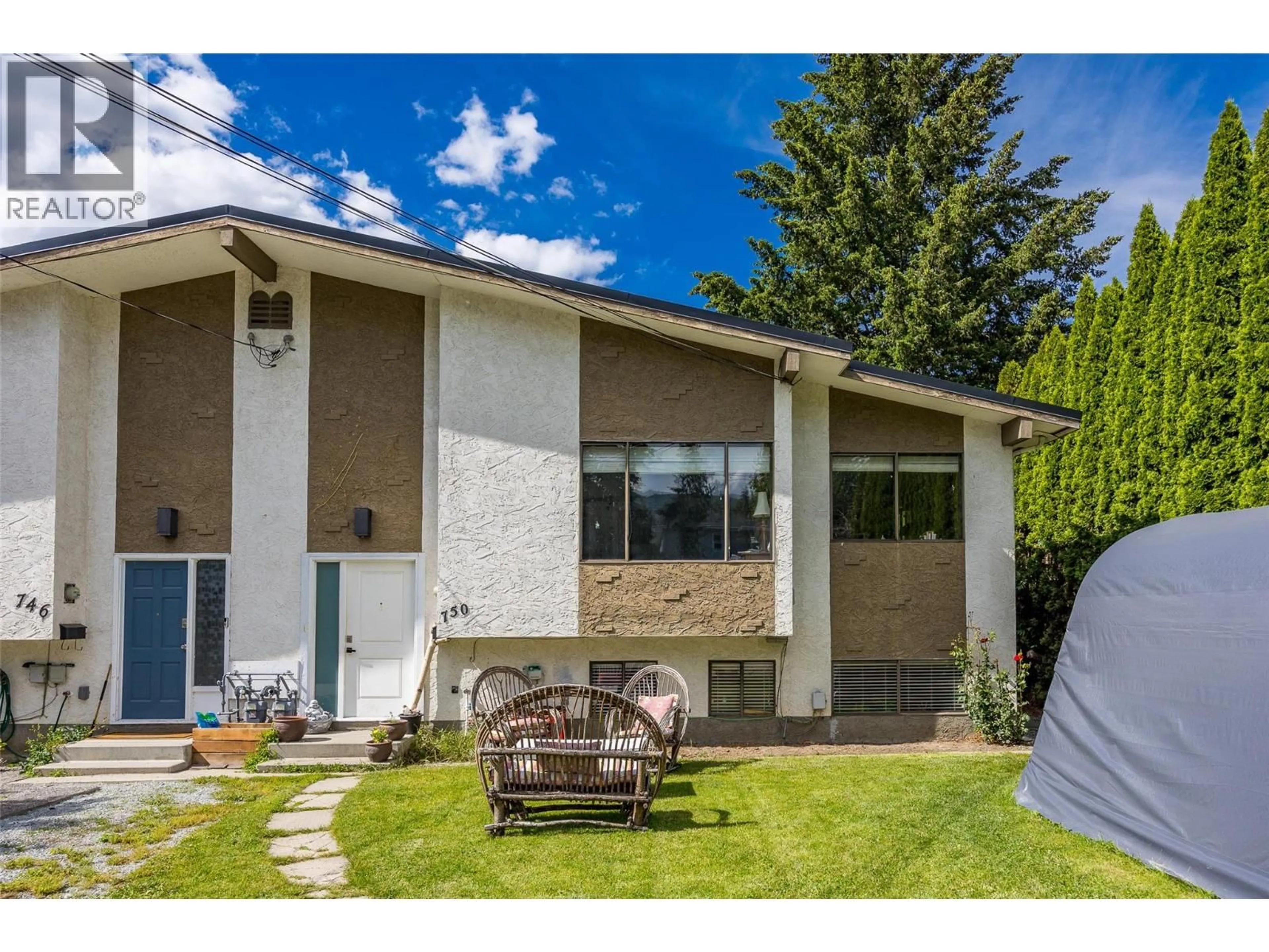 Home with vinyl exterior material, street for 750 MCCLURE ROAD, Kelowna British Columbia V1W1M2
