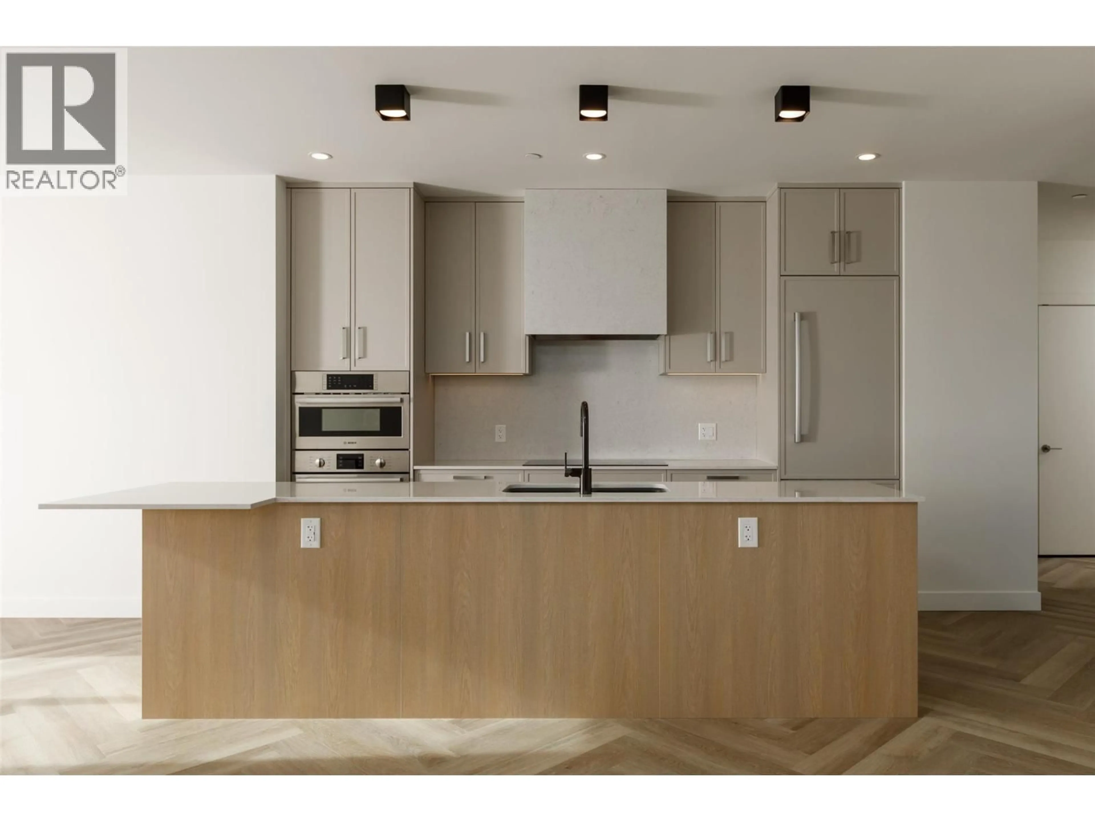 Open concept kitchen, wood/laminate floor for 511 - 3340 LAKESHORE ROAD, Kelowna British Columbia V1W0H6
