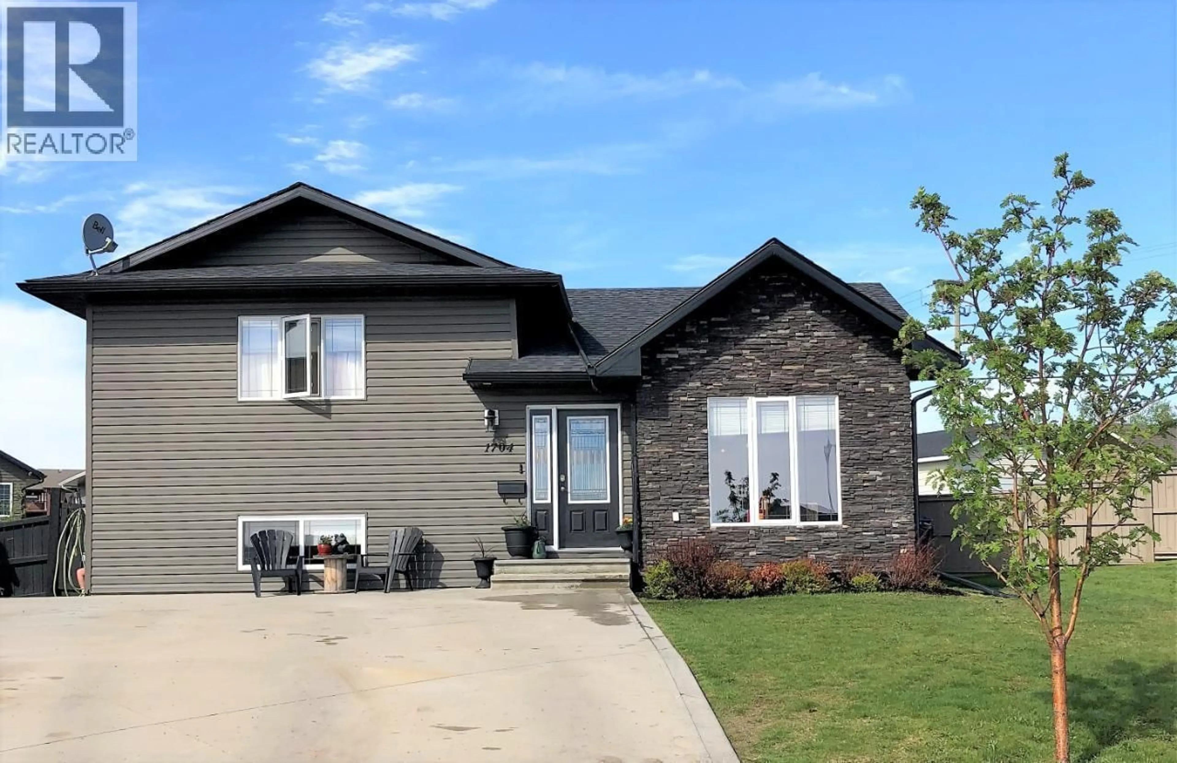 Home with brick exterior material, street for 1704 86 AVENUE, Dawson Creek British Columbia V1G0B2