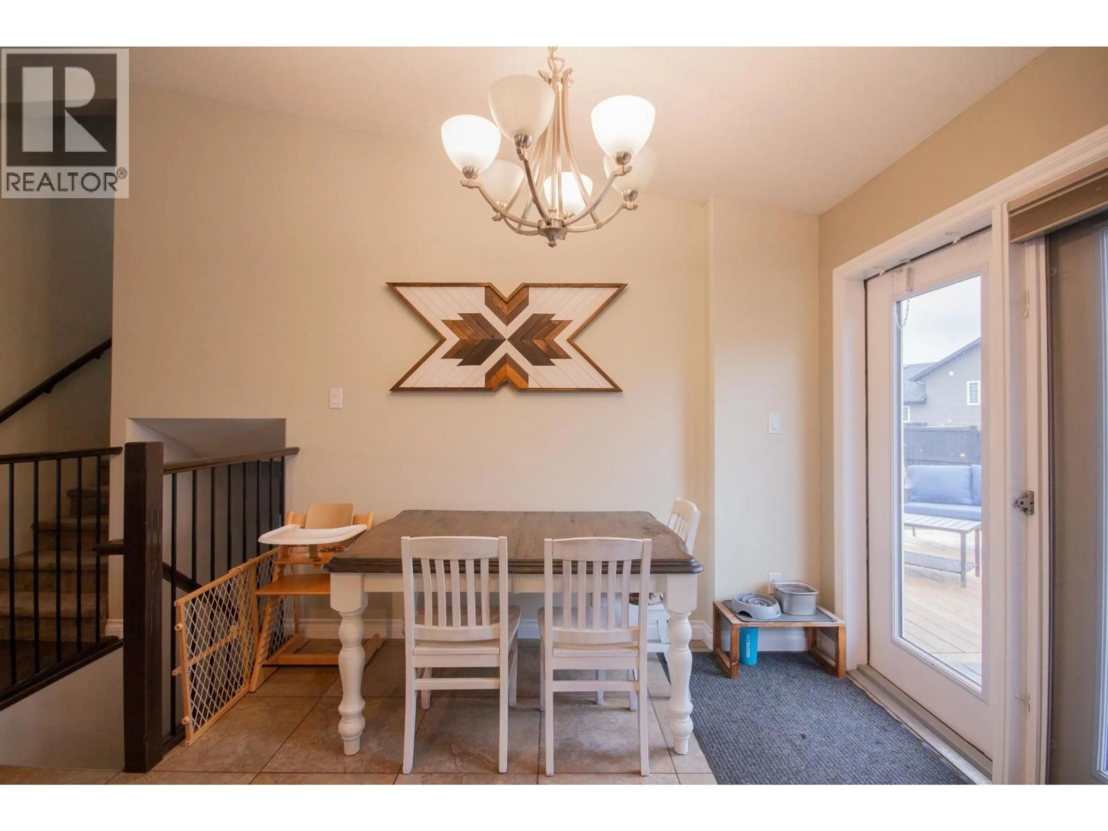 Dining room, wood/laminate floor for 1704 86 AVENUE, Dawson Creek British Columbia V1G0B2