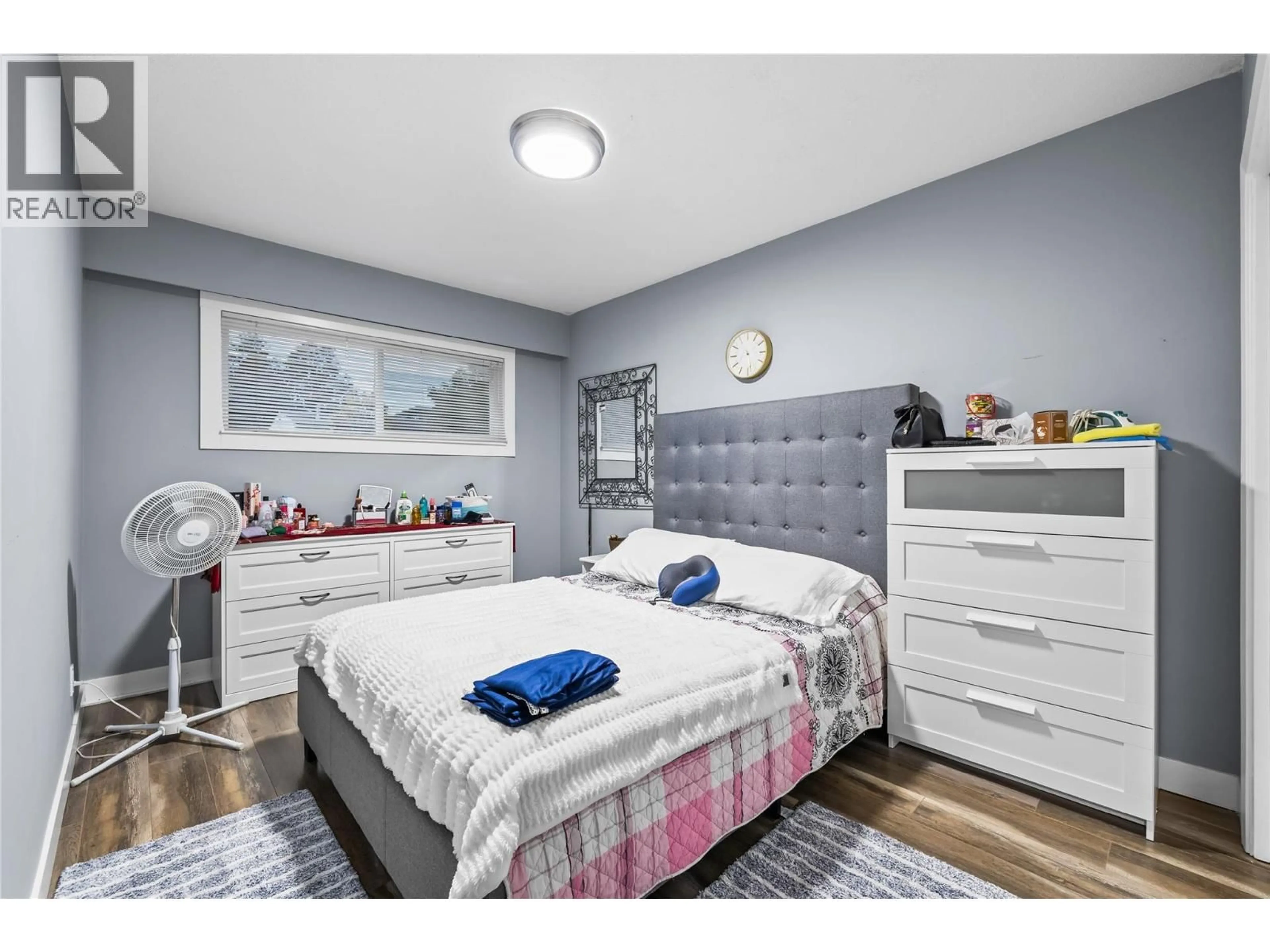 Bedroom with bed, wood/laminate floor for 205 HOMER ROAD, Kelowna British Columbia V1X3Z6
