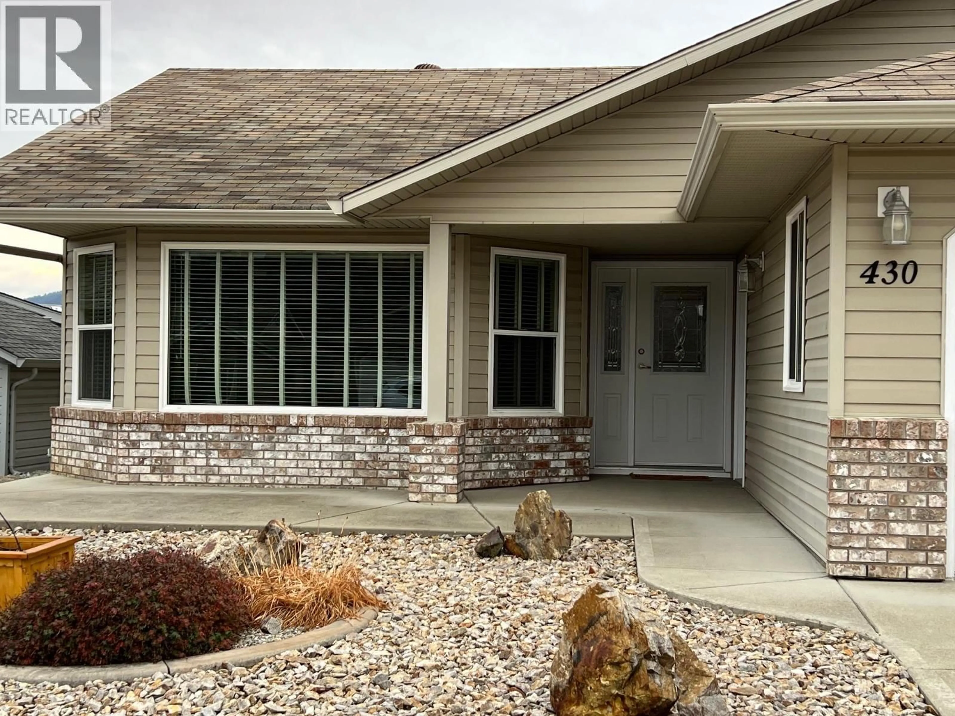 Home with vinyl exterior material, street for 430 4 STREET, Vernon British Columbia V1H1Z1