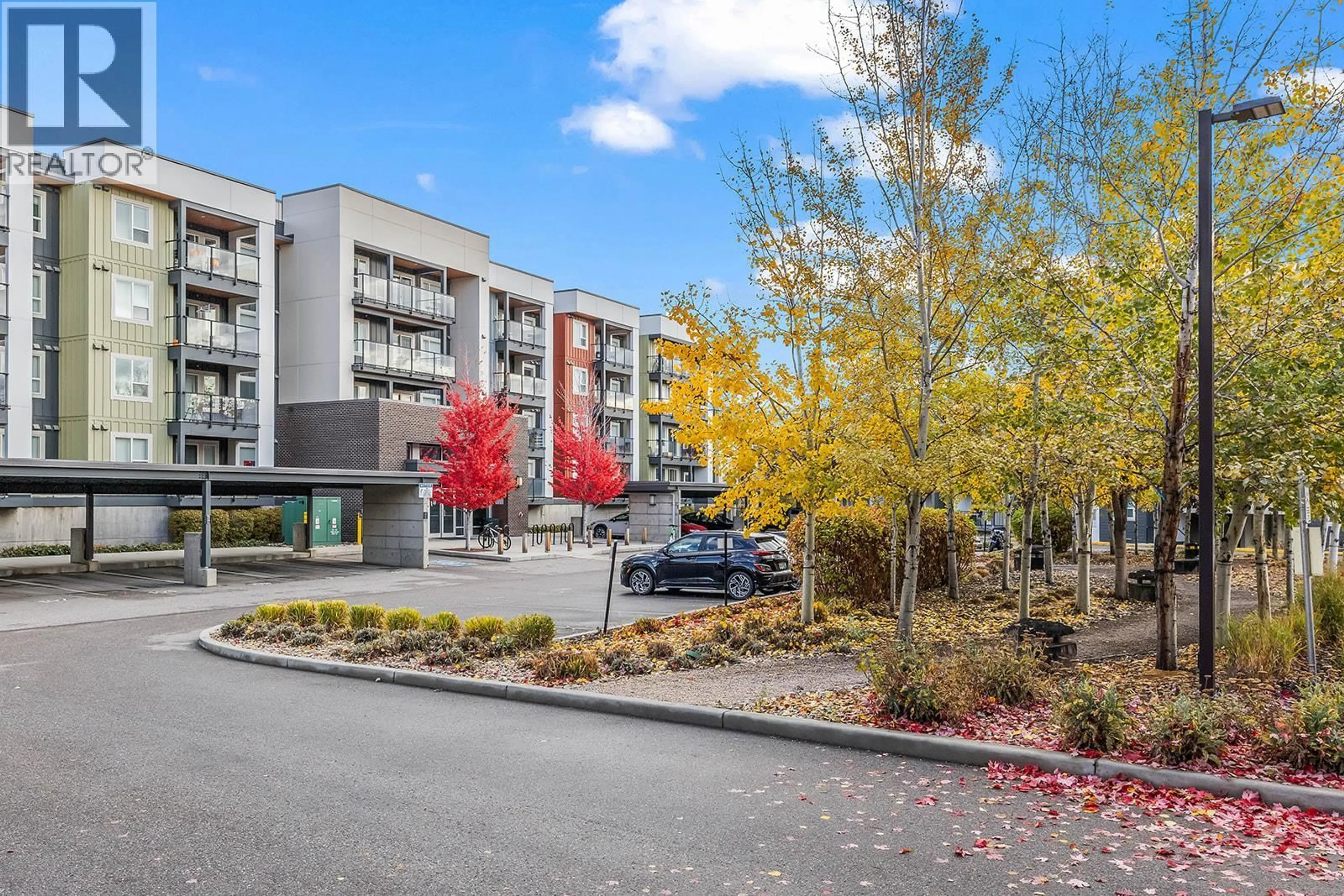 A pic from outside/outdoor area/front of a property/back of a property/a pic from drone, unknown for 205 - 775 ACADEMY WAY, Kelowna British Columbia V1V0A5
