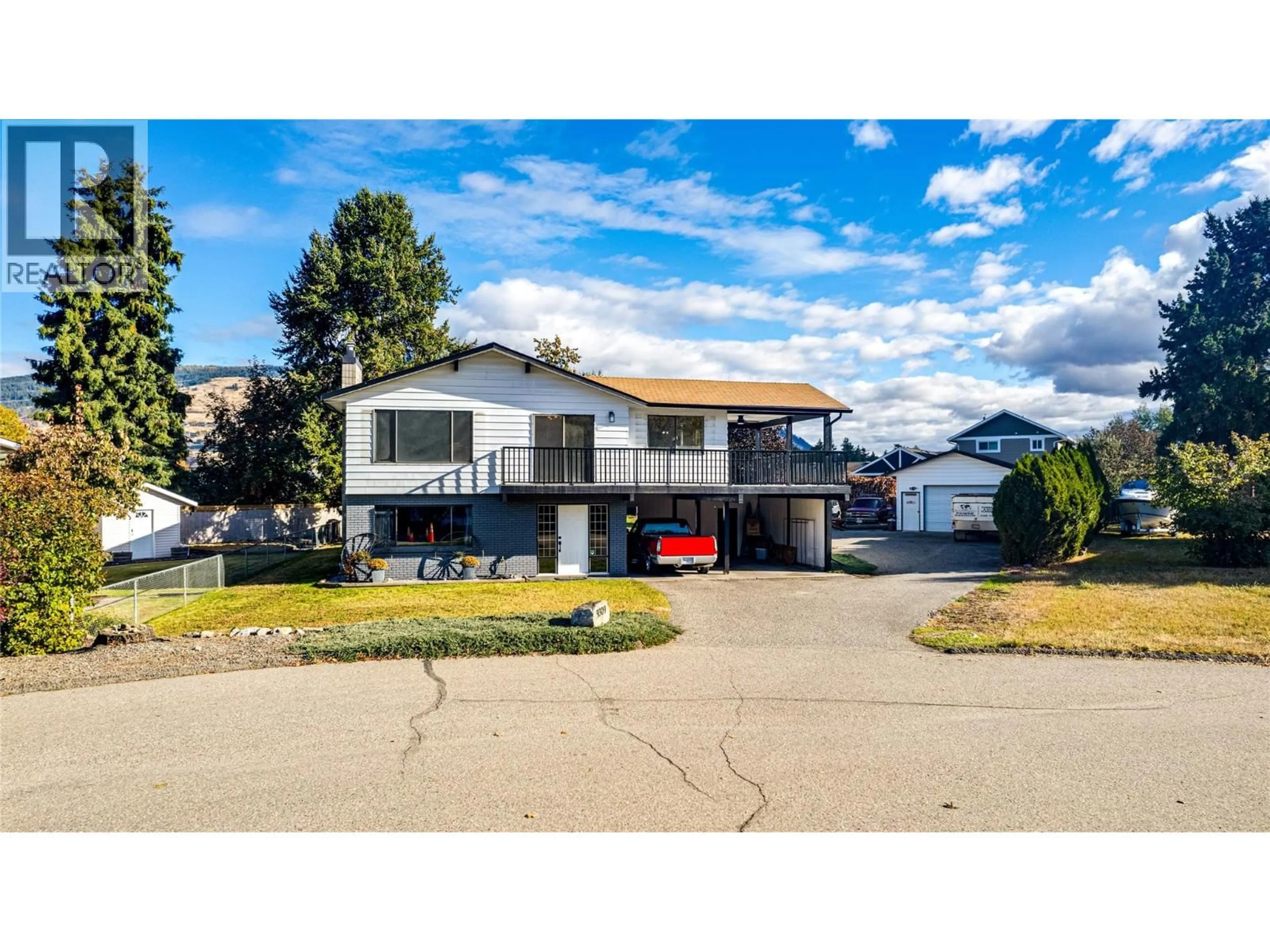 Home with vinyl exterior material, street for 9309 BEL AIR DRIVE, Coldstream British Columbia V1B2A1