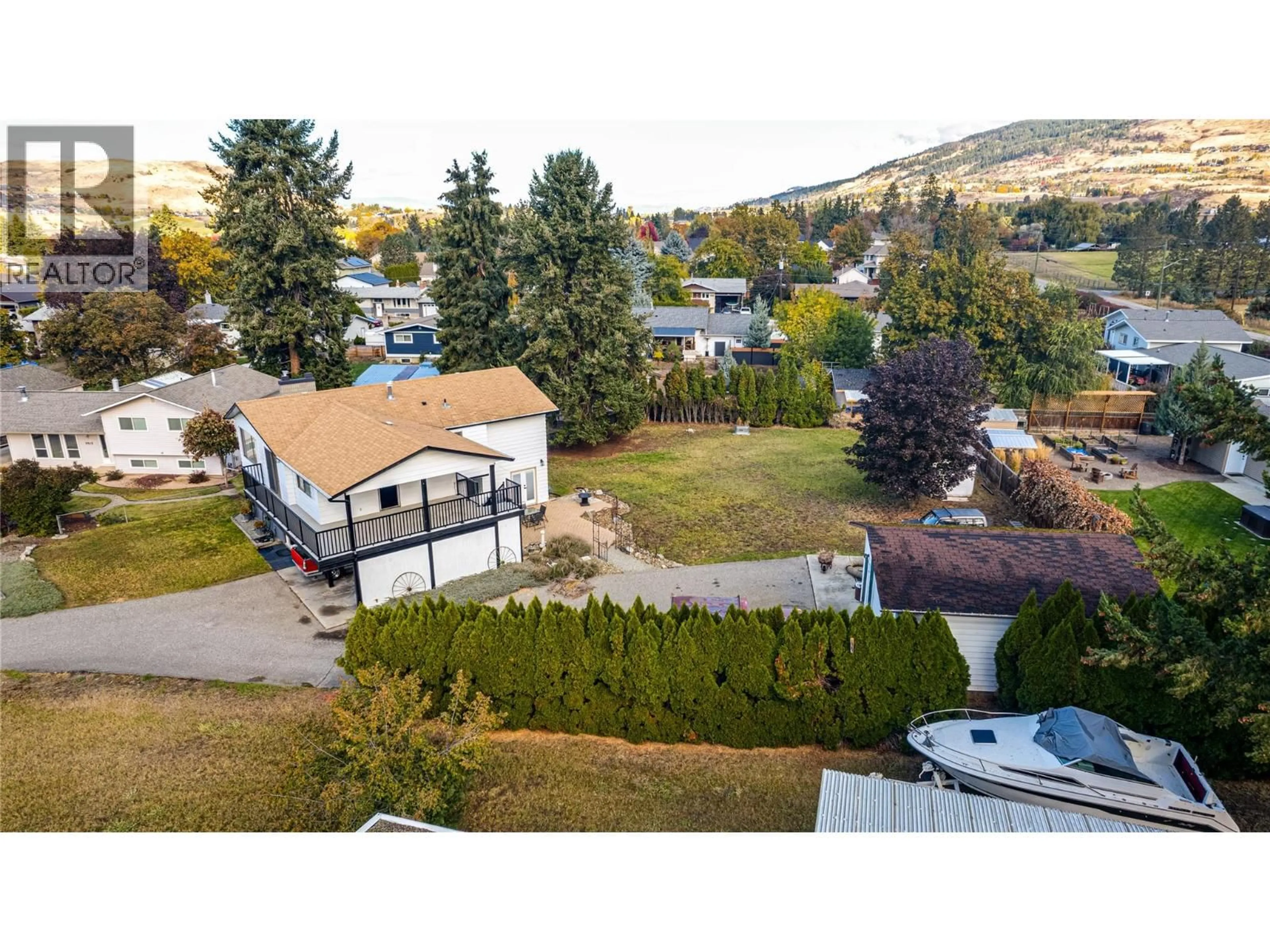 A pic from outside/outdoor area/front of a property/back of a property/a pic from drone, mountain view for 9309 BEL AIR DRIVE, Coldstream British Columbia V1B2A1