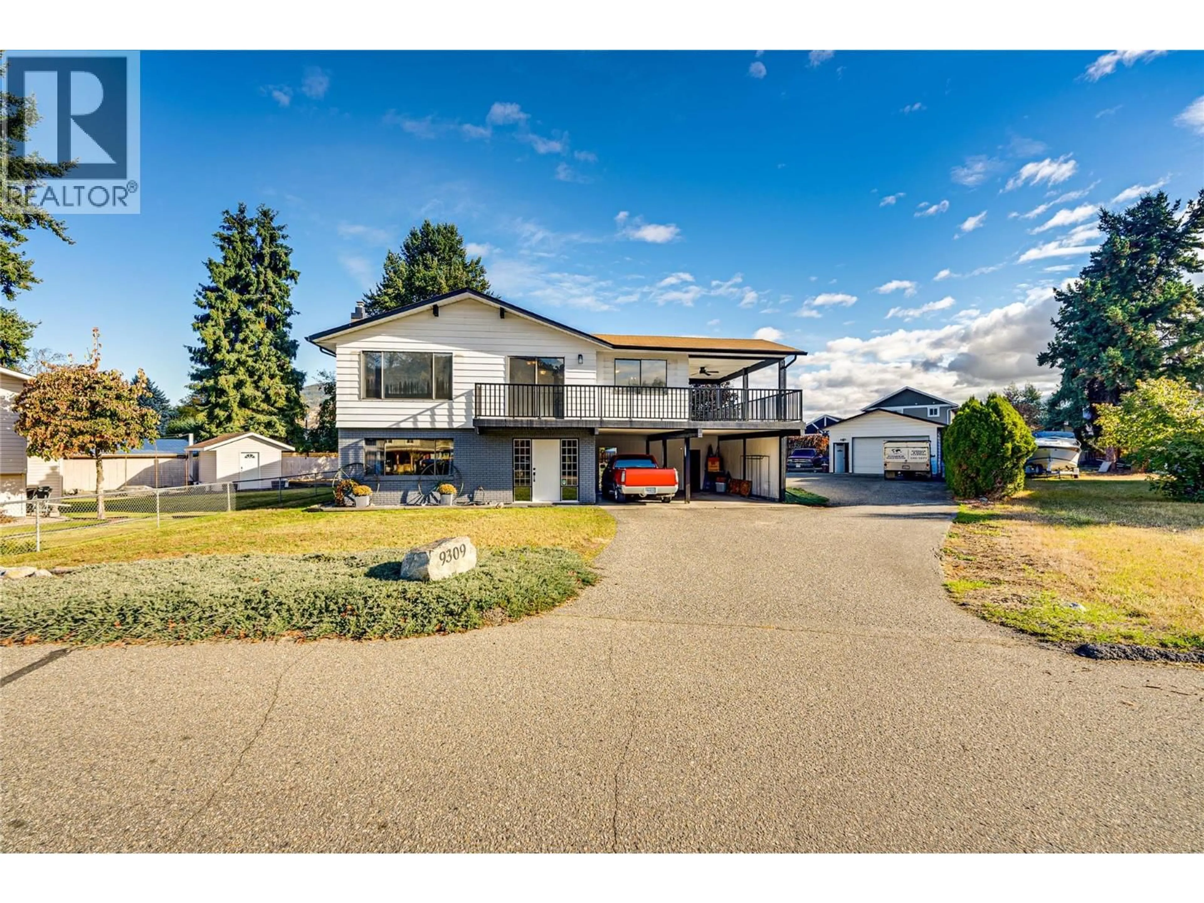 A pic from outside/outdoor area/front of a property/back of a property/a pic from drone, street for 9309 BEL AIR DRIVE, Coldstream British Columbia V1B2A1