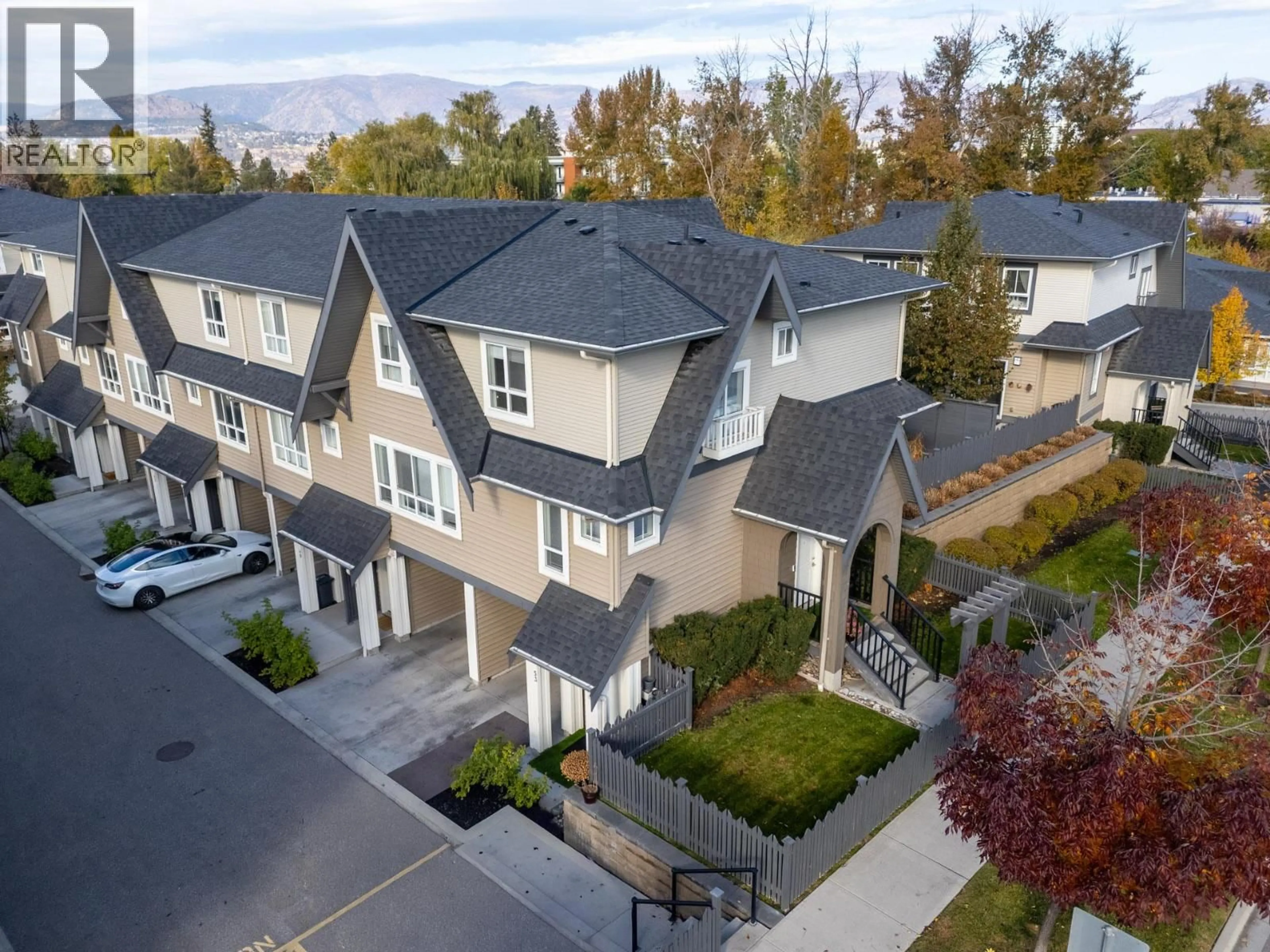 A pic from outside/outdoor area/front of a property/back of a property/a pic from drone, street for 53 - 680 OLD MEADOWS ROAD, Kelowna British Columbia V1W5L4