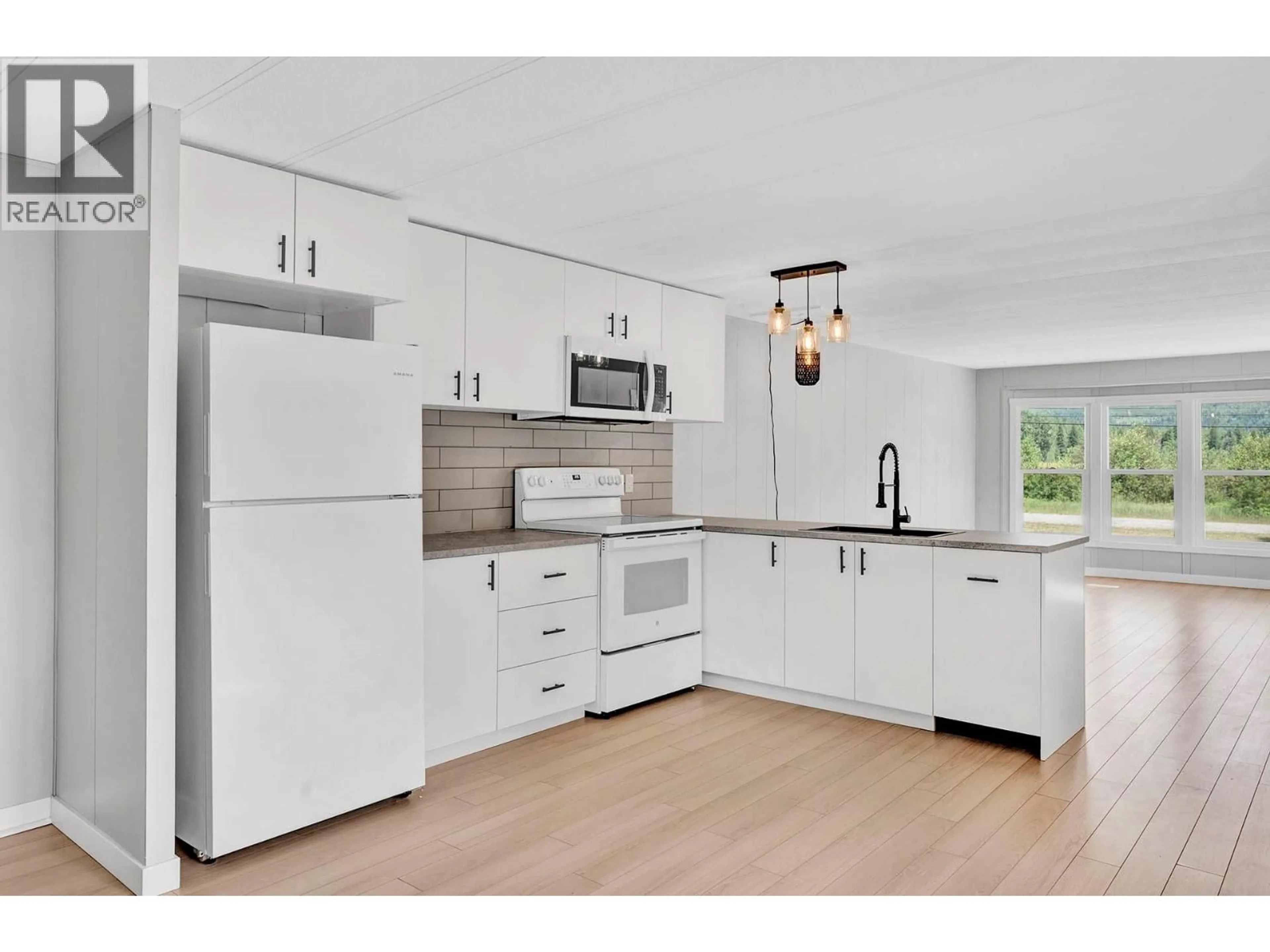 Open concept kitchen, wood/laminate floor for 14 - 851 OLD NORTH THOMPSON HIGHWAY, Clearwater British Columbia V0E1N2