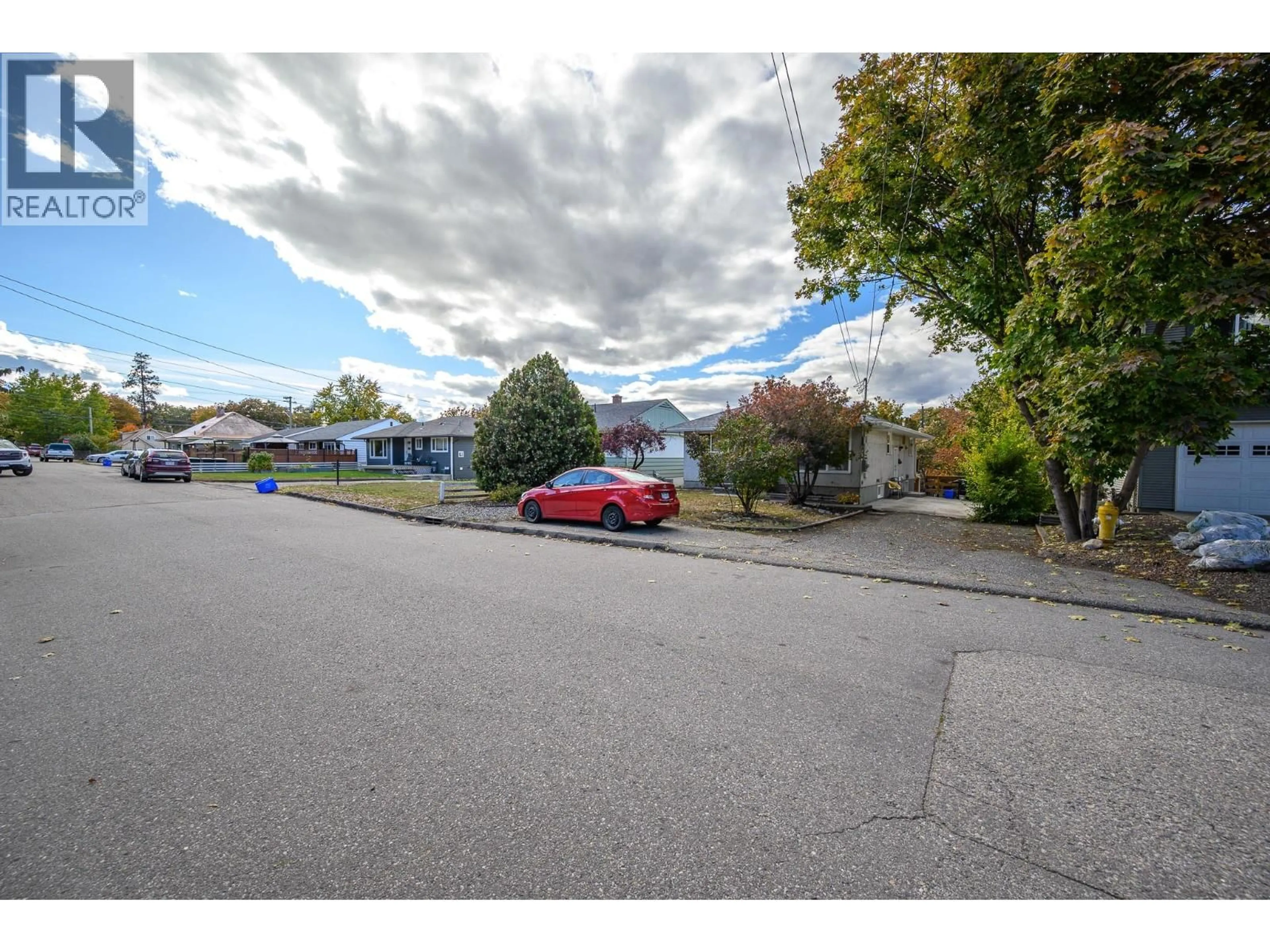 A pic from outside/outdoor area/front of a property/back of a property/a pic from drone, street for 3302 24 STREET, Vernon British Columbia V1T4N6
