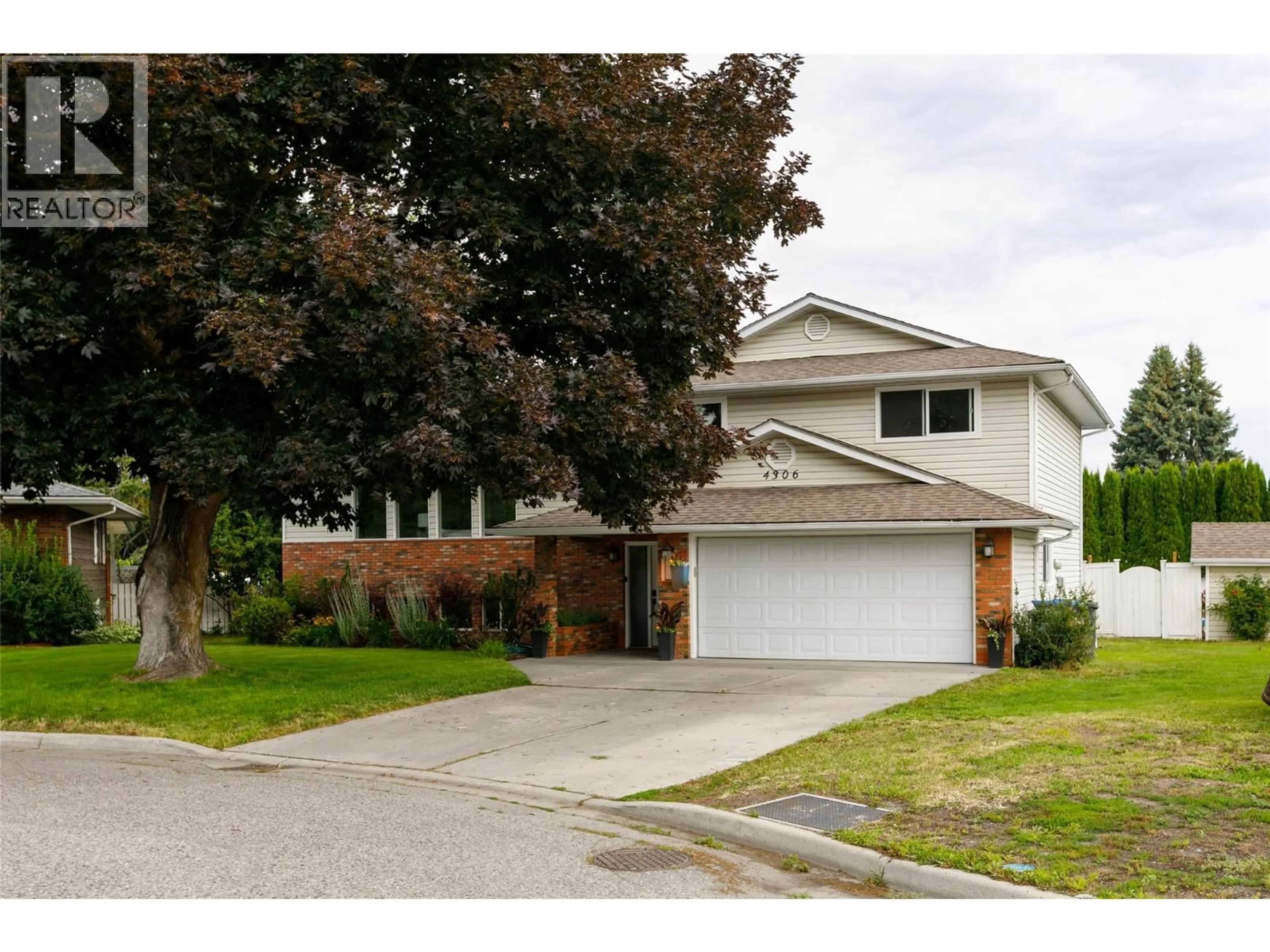 Home with vinyl exterior material, street for 4306 SAN MICHELLE COURT, Kelowna British Columbia V1W2J3