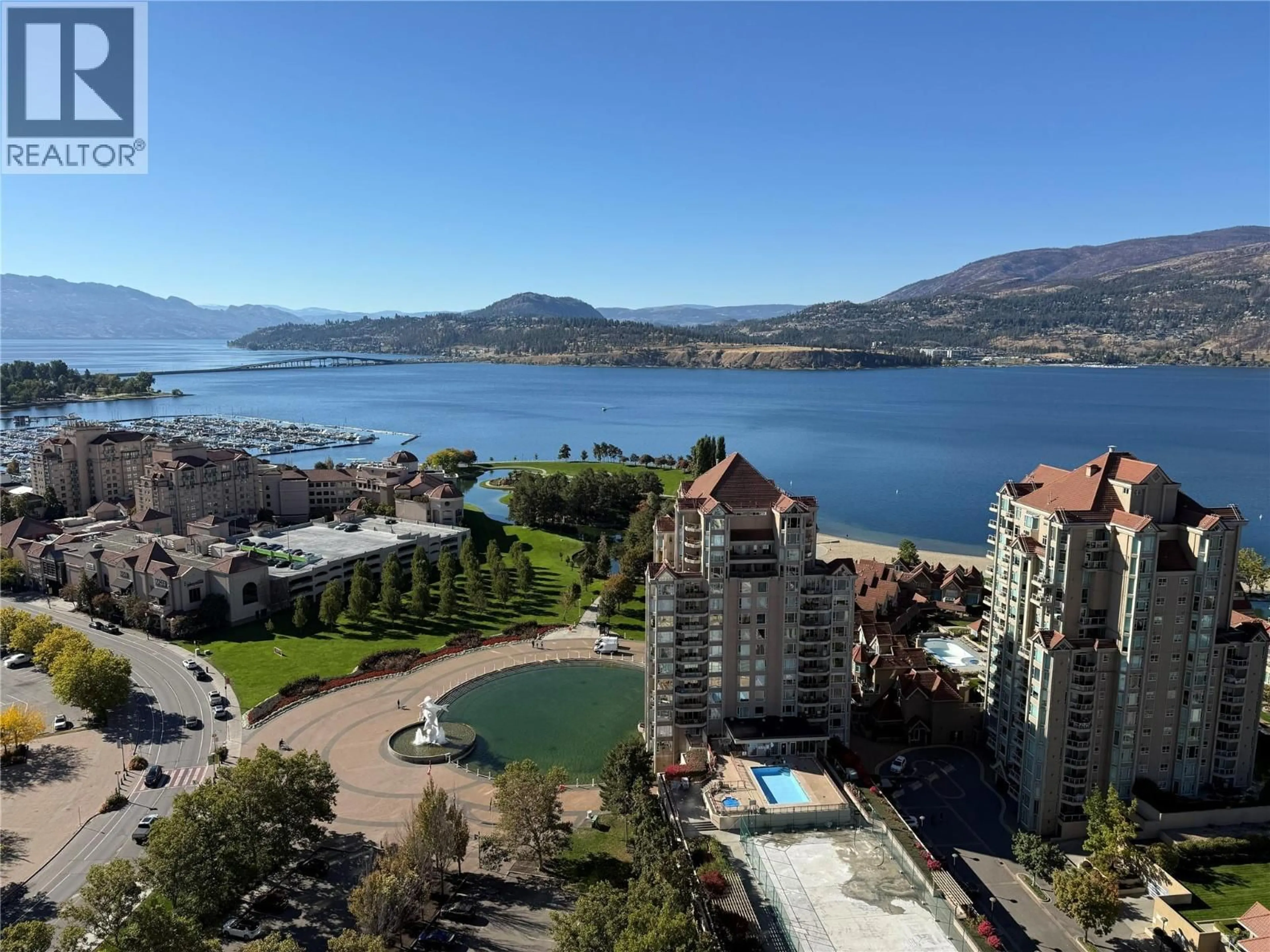 A pic from outside/outdoor area/front of a property/back of a property/a pic from drone, water/lake/river/ocean view for 2305 - 1181 SUNSET DRIVE, Kelowna British Columbia V1Y0L4