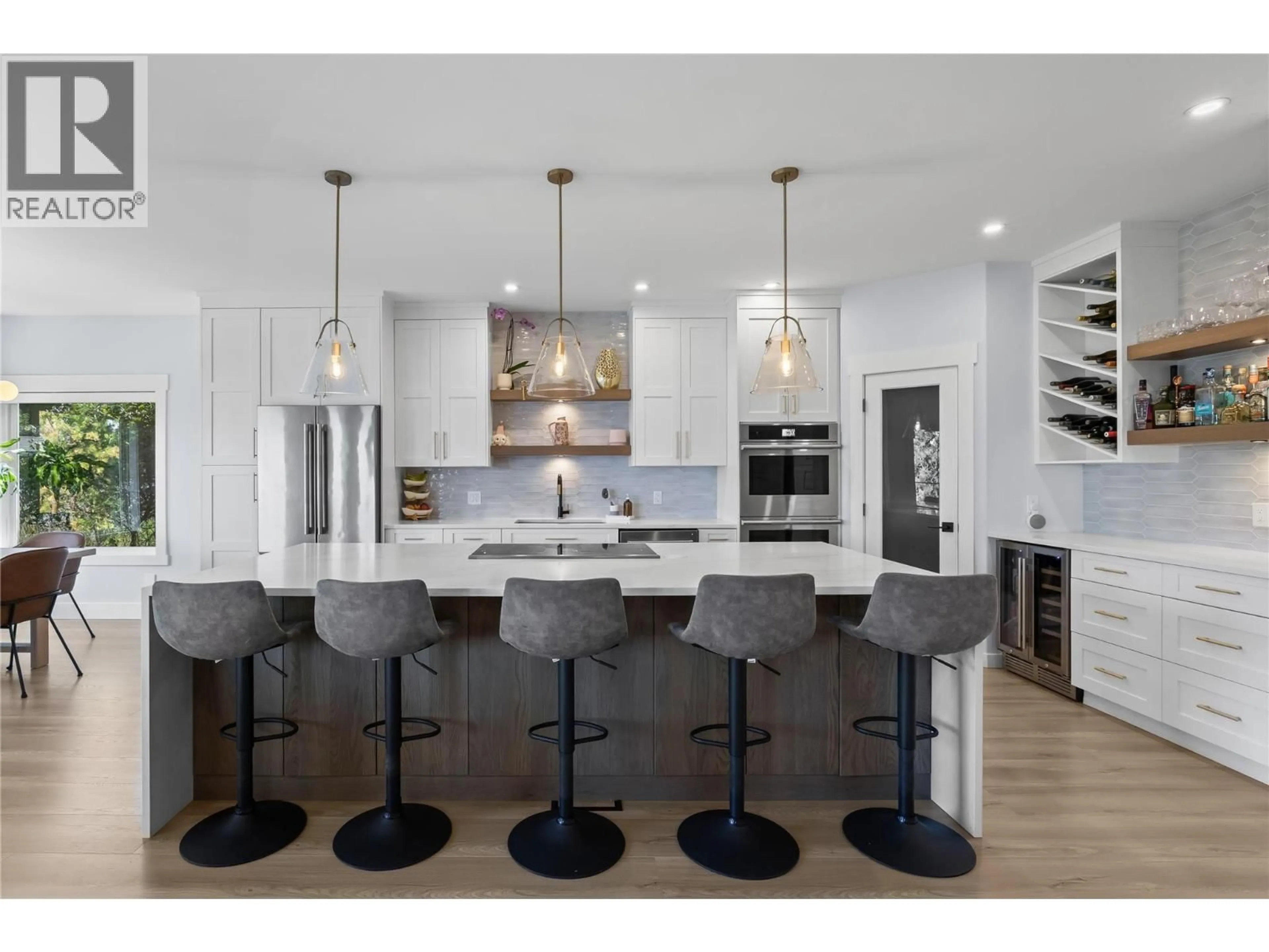 Open concept kitchen, wood/laminate floor for 408 QUILCHENA CRESCENT, Kelowna British Columbia V1W4W4