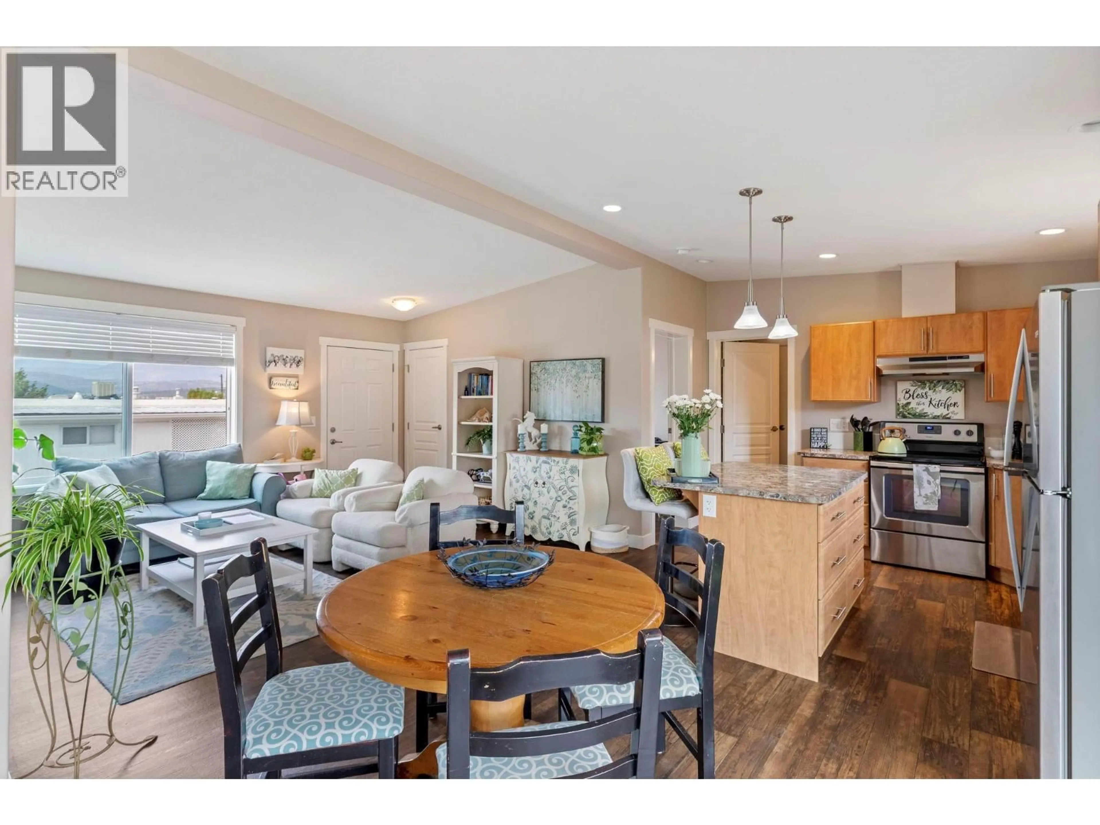 Open concept kitchen, wood/laminate floor for 220 - 3591 OLD VERNON ROAD, Kelowna British Columbia V1X6P4