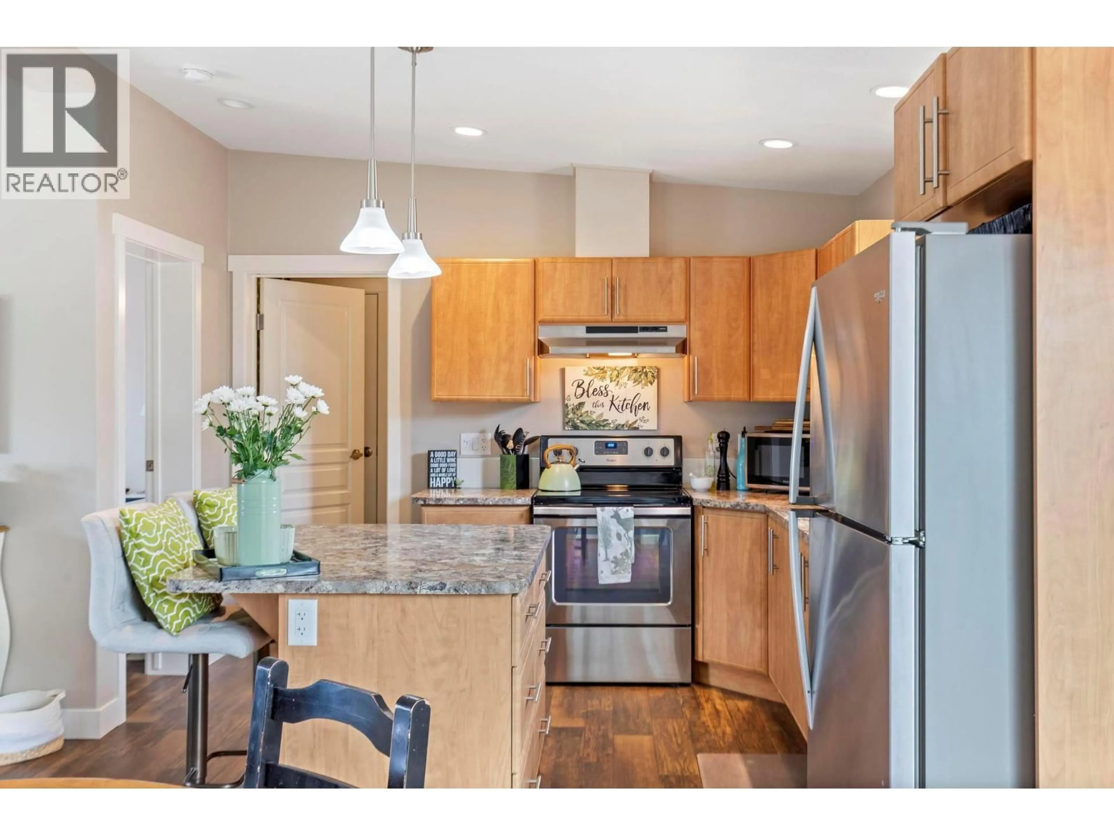 Open concept kitchen, wood/laminate floor for 220 - 3591 OLD VERNON ROAD, Kelowna British Columbia V1X6P4