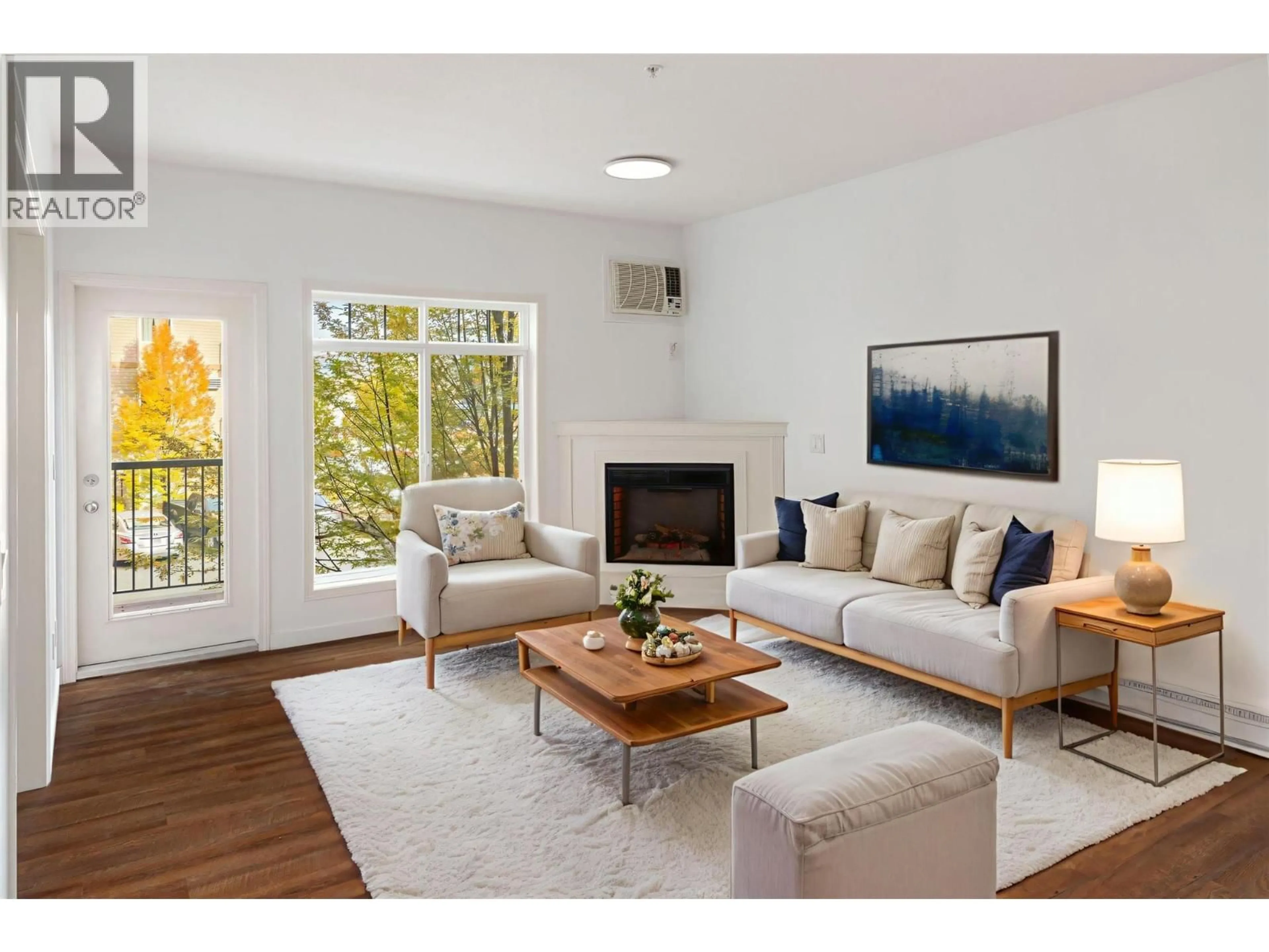 Living room with furniture, wood/laminate floor for 206 - 250 HOLLYWOOD ROAD SOUTH, Kelowna British Columbia V1X3S9