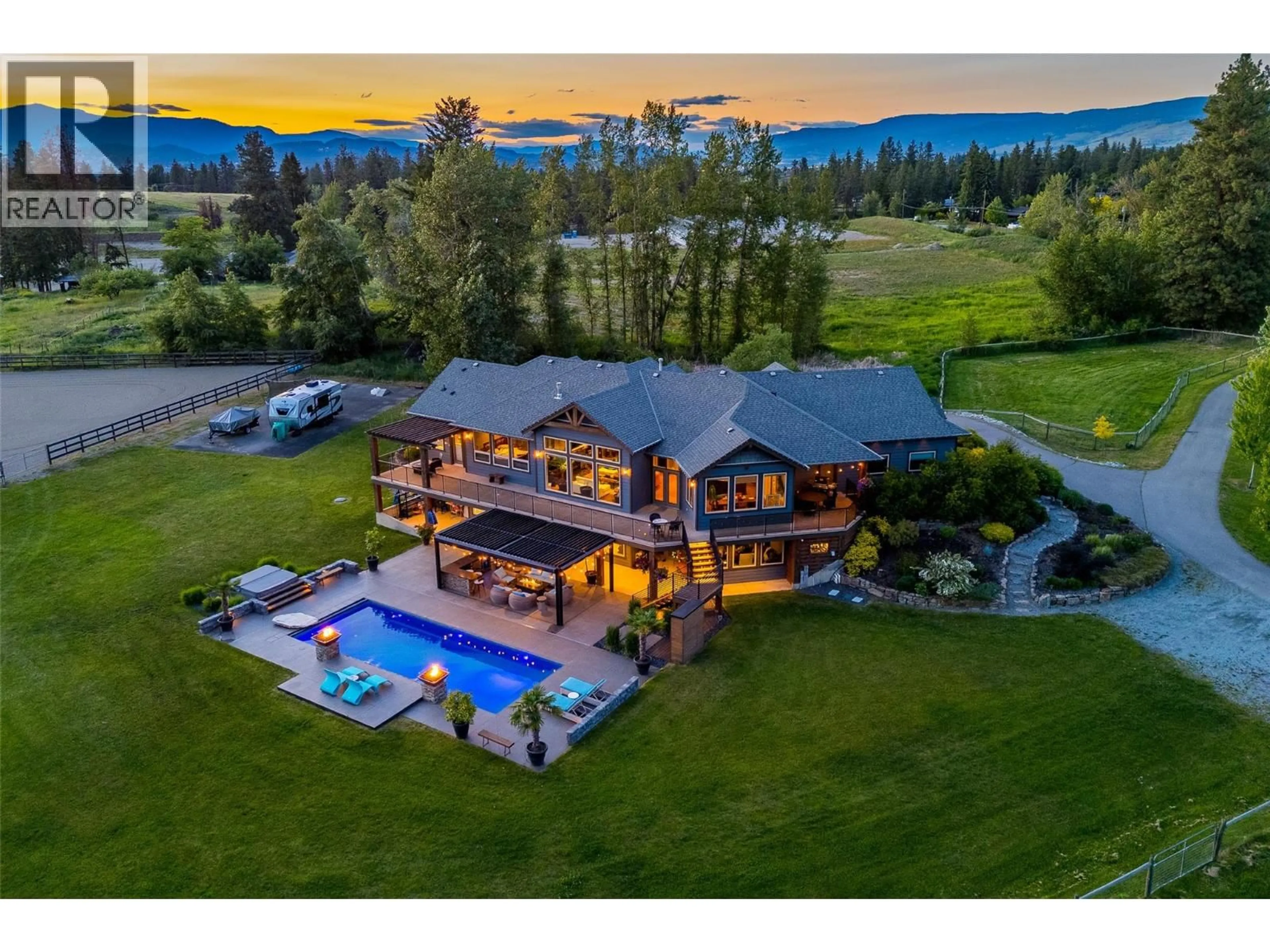 A pic from outside/outdoor area/front of a property/back of a property/a pic from drone, mountain view for 4284 JAUD ROAD, Kelowna British Columbia V1W4C5