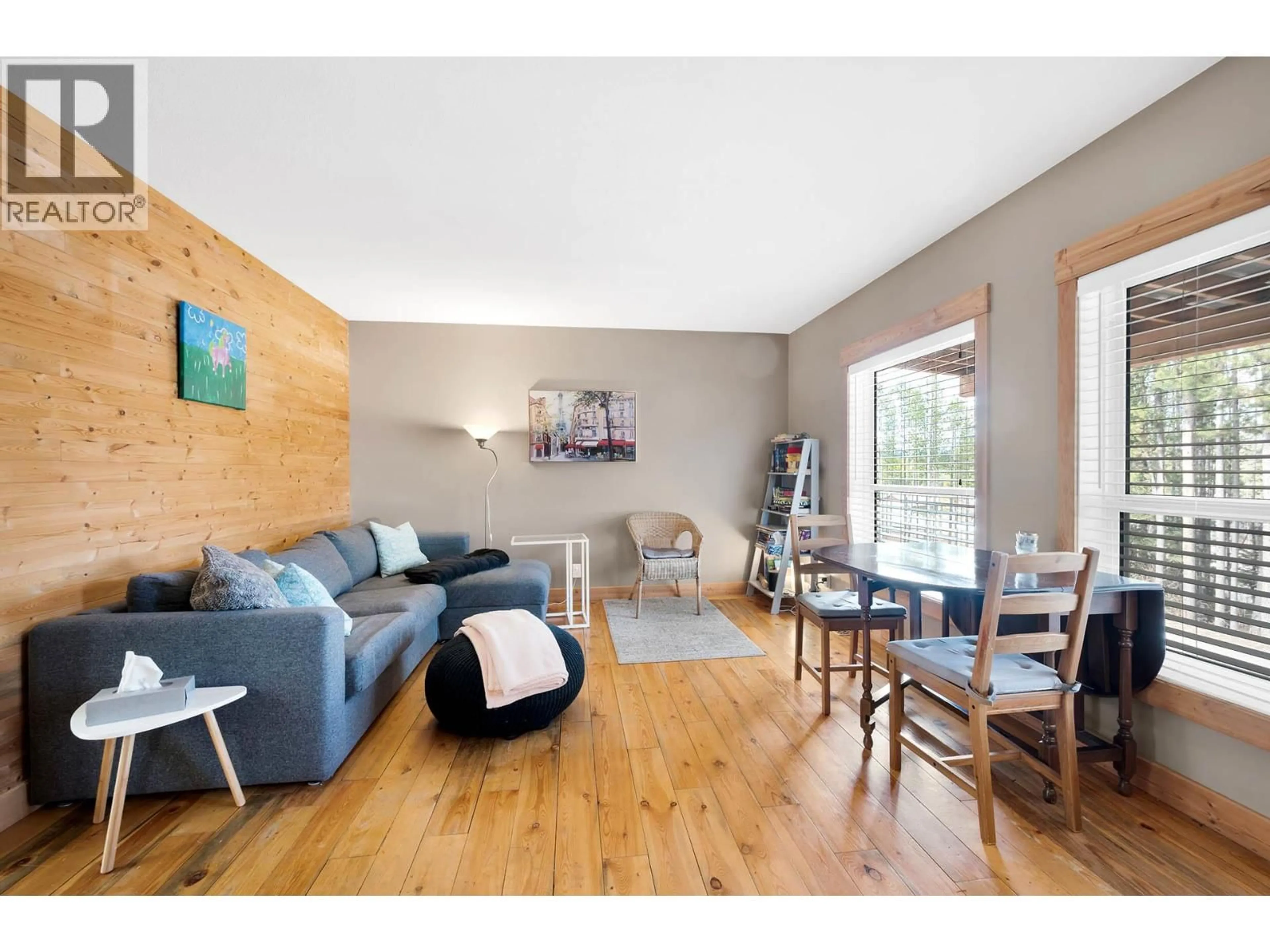 Living room with furniture, wood/laminate floor for 5873 LAC LE JEUNE ROAD, Kamloops British Columbia V1S1Y8