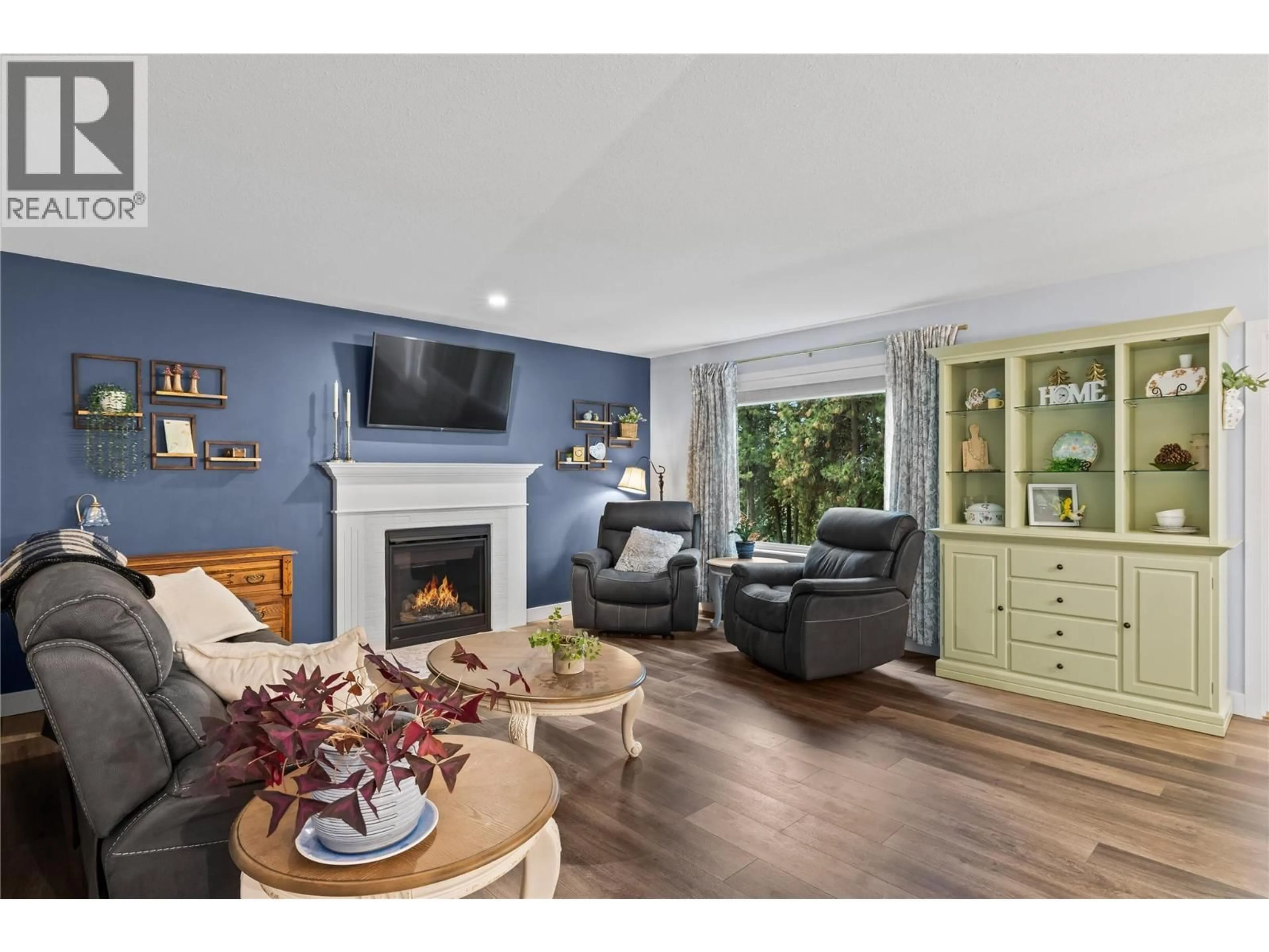 Living room with furniture, wood/laminate floor for 2205 SHANNON WOODS PLACE, West Kelowna British Columbia V4T2L9