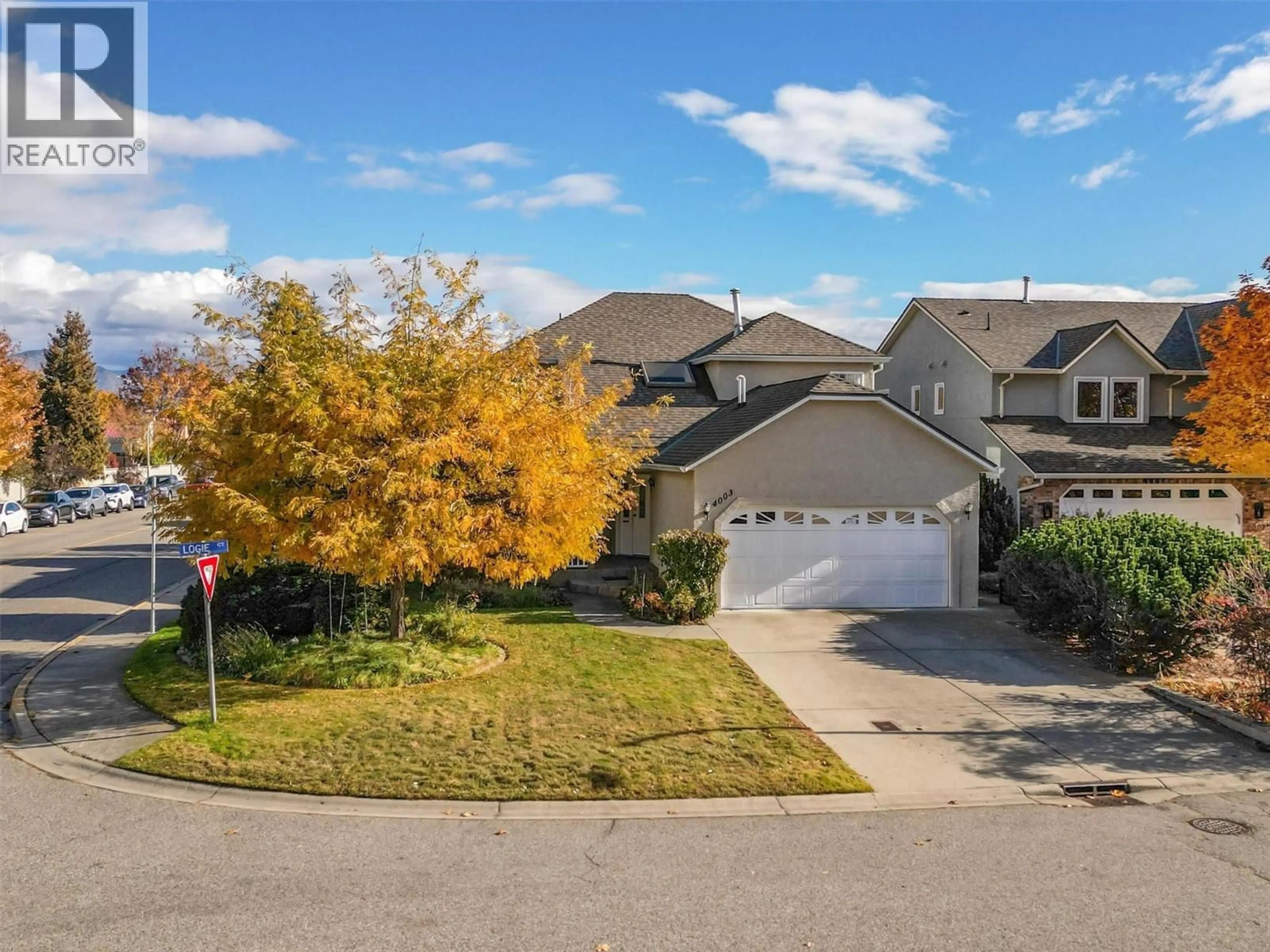 A pic from outside/outdoor area/front of a property/back of a property/a pic from drone, street for 4003 LOGIE COURT, Kelowna British Columbia V1W3Y6